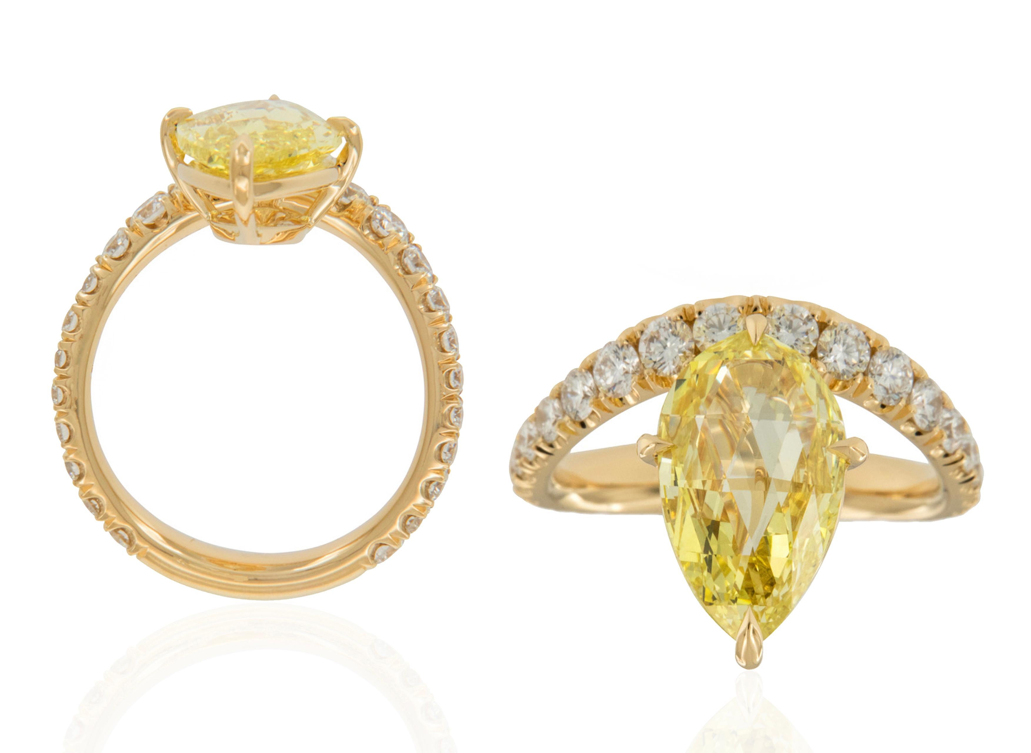 An exclusive, beautiful and elegant piece is this one of a kind Fancy Intense Yellow Diamond Briolette Cut Ring in 18K Yellow Gold, from our 'G-One' Collection. It will be a very important piece to have in your collection, and you will dazzle with