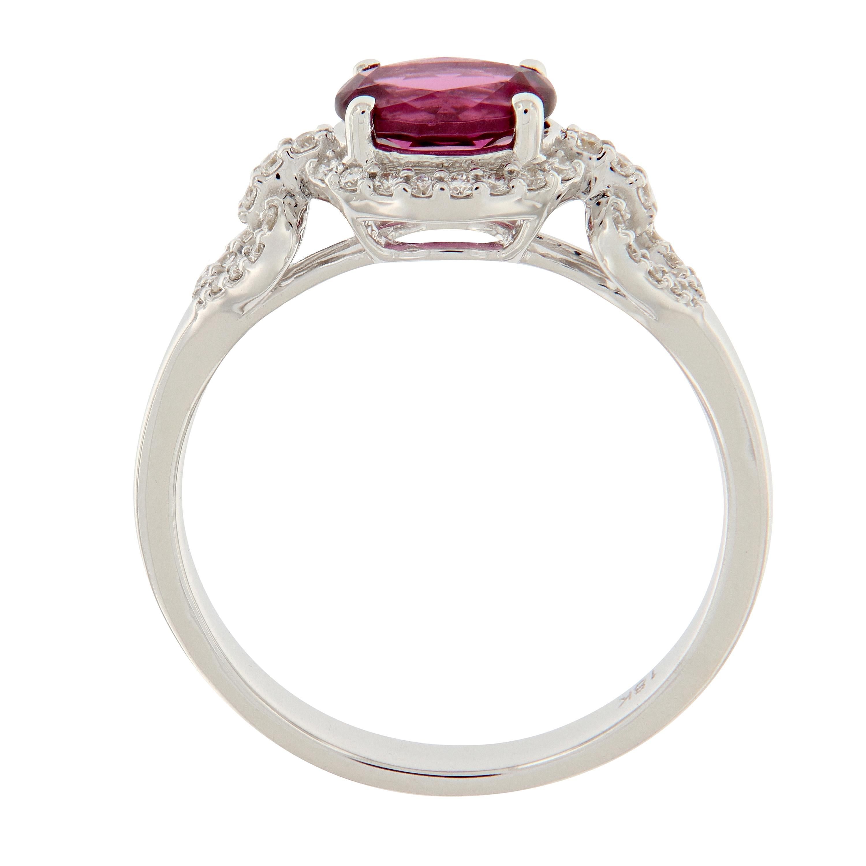 The ring centers around an oval faceted garnet surrounded with diamonds and crafted in 18k white gold. Ring is from the Gossip Collection designed by Goshwara. Ring size 7. Weighs 3.7 grams.
Marked Goshwara.

Garnet 1.03 carat
Diamonds 0.19 cttw