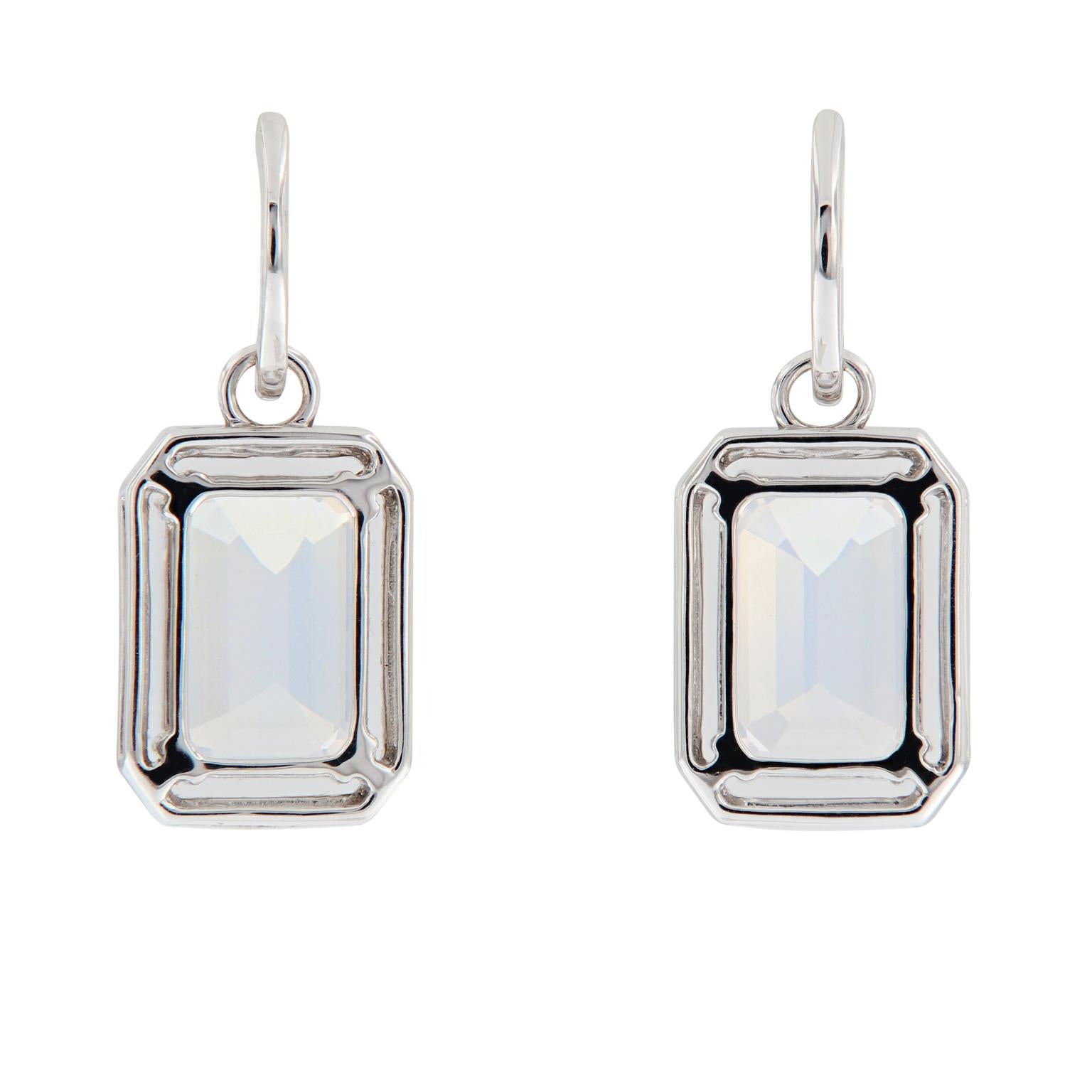 Earrings center around emerald cut moon quartz, accented with a halo of diamonds and crafted in 18k white gold. Earrings are from the Gossip Collection designed by Goshwara. Weigh 7.1 grams. 12mm x 27mm. Marked Goshwara.

Moon Quartz 7.31