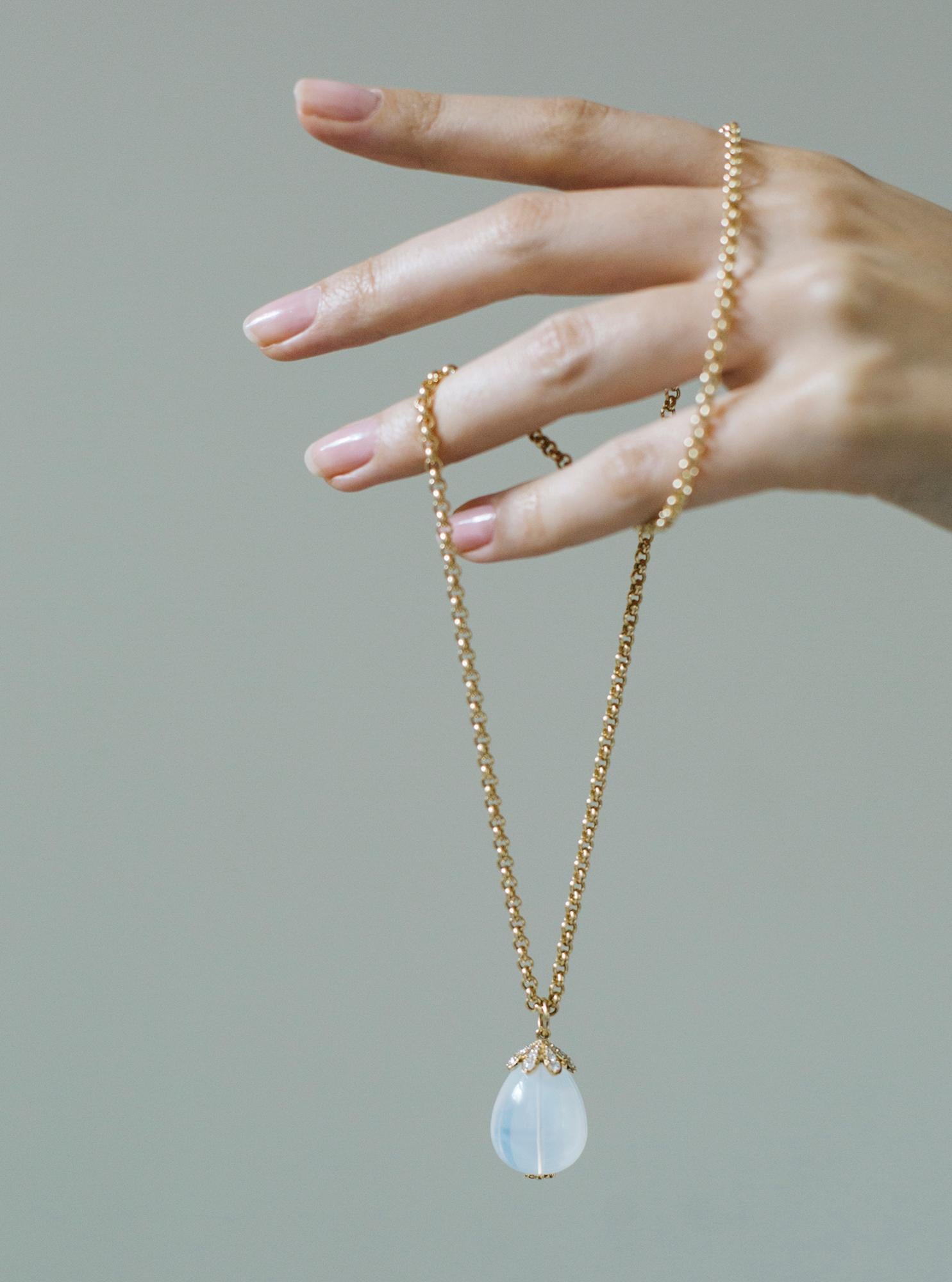 This Large Moon Quartz Pendant with Diamonds in 18K Yellow Gold is a stunning piece of jewelry from the 'Naughty' Collection. The pendant features a large moon quartz gemstone surrounded by a dazzling array of diamonds in the cap, set in a lustrous