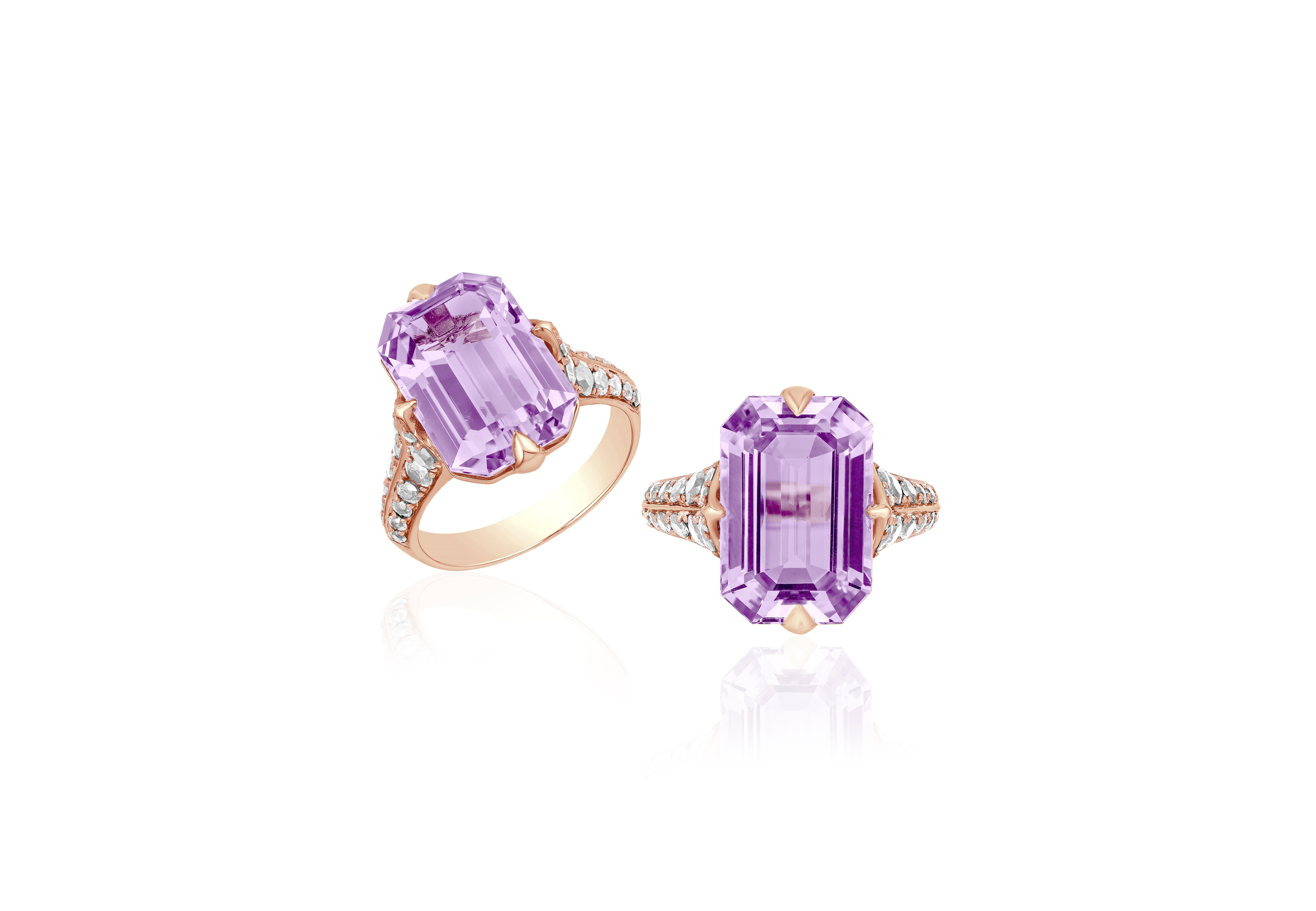 This Lavender Amethyst Emerald Cut Ring with Diamonds is a stunning piece of jewelry from the 'Rain Forest' Collection. The ring is crafted from 18K rose gold and features a beautiful emerald-cut lavender amethyst as its centerpiece, surrounded by
