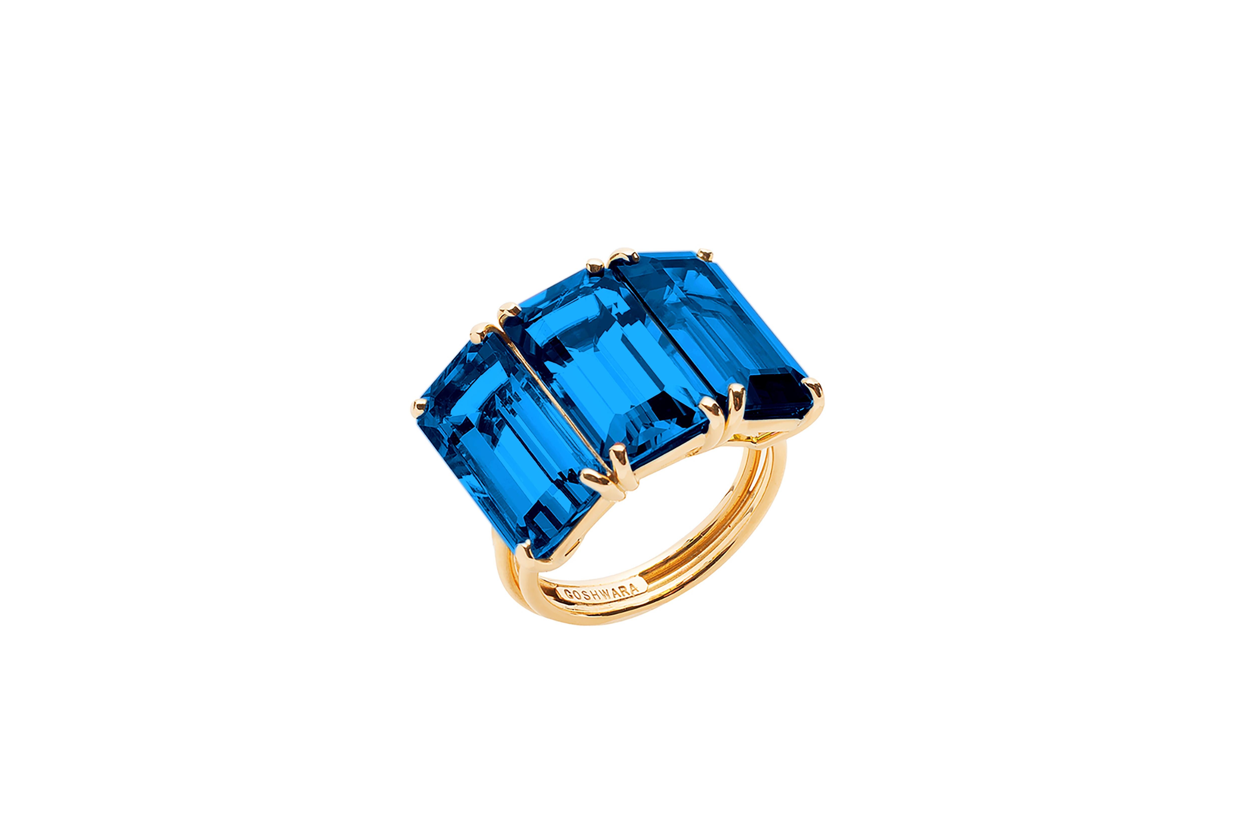 London Blue Topaz 3 Stone Emerald Cut Ring in 18K Yellow Gold from 'Gossip' Collection

Stone Size: 13 x 7 mm

Gemstone Approx. Wt: 14.07 Carats (London Blue Topaz)