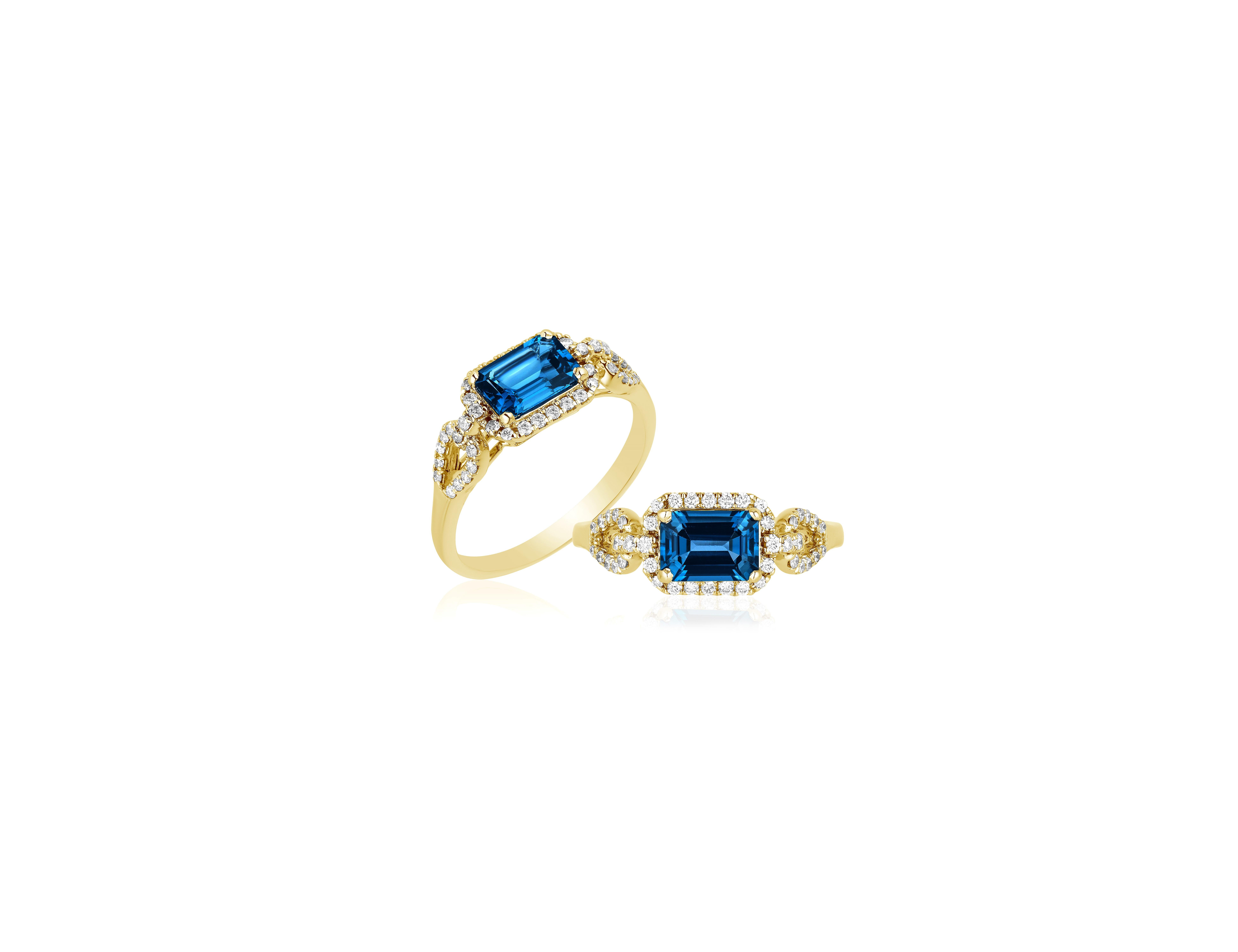London Blue Topaz Small Emerald Cut Ring in 18K Yellow Gold from 'Gossip' Collection

Stone Size: 7 x 5 mm

Diamonds: G-H / VS, Approx Wt: 0.21 Cts