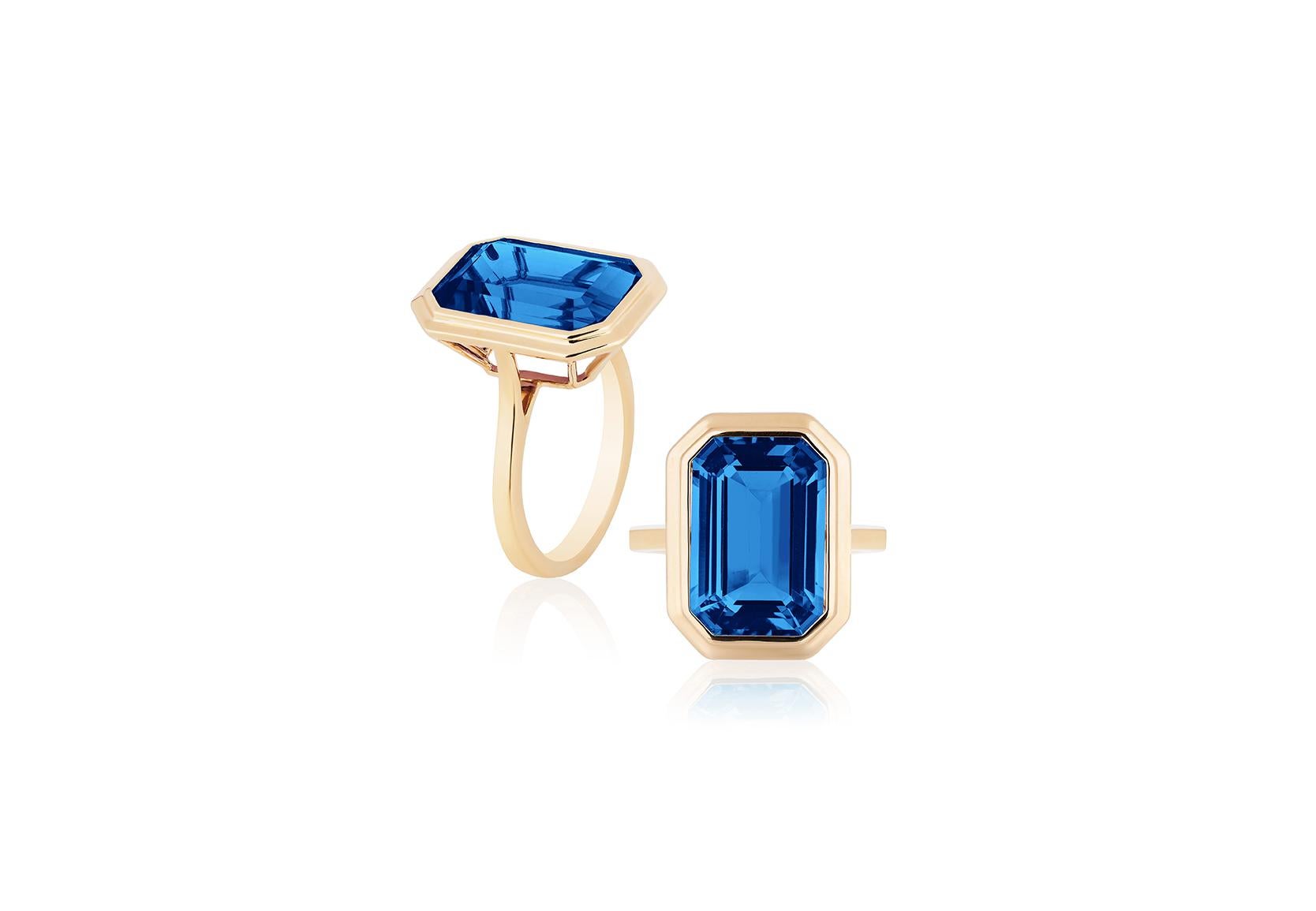 A classic yet an everyday bold statement piece, this amazing cocktail ring is part of our very new ‘Manhattan’ Collection. It has a 10 x 15 mm emerald cut London Blue Topaz in a bezel setting in 18k gold.   ​

Minimalist lines yet bold structures is