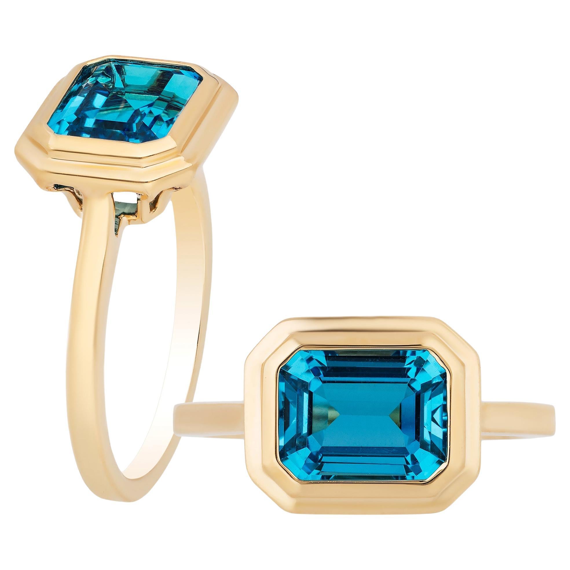 Goshwara London Blue Topaz Emerald Cut Bezel Set Ring For Sale