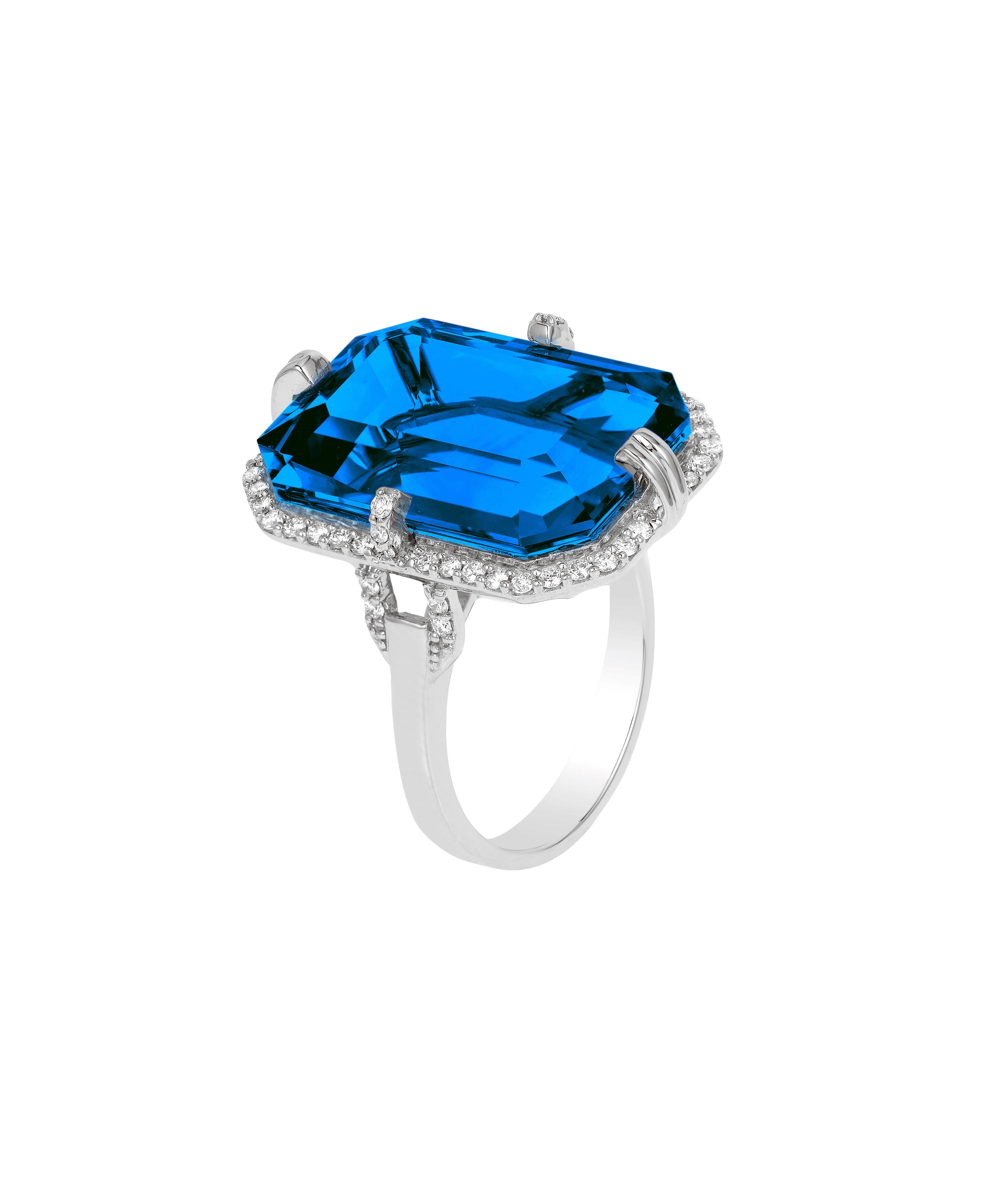 London Blue Topaz Emerald Cut Ring with Diamonds in 18K White Gold, From 'Gossip' Collection

Stone Size: 20 x 14 mm 

Gemstone Approx Wt: London Blue Topaz - 21.60 Carats

Diamonds: G-H / VS, Approx Wt: 0.41 Carats