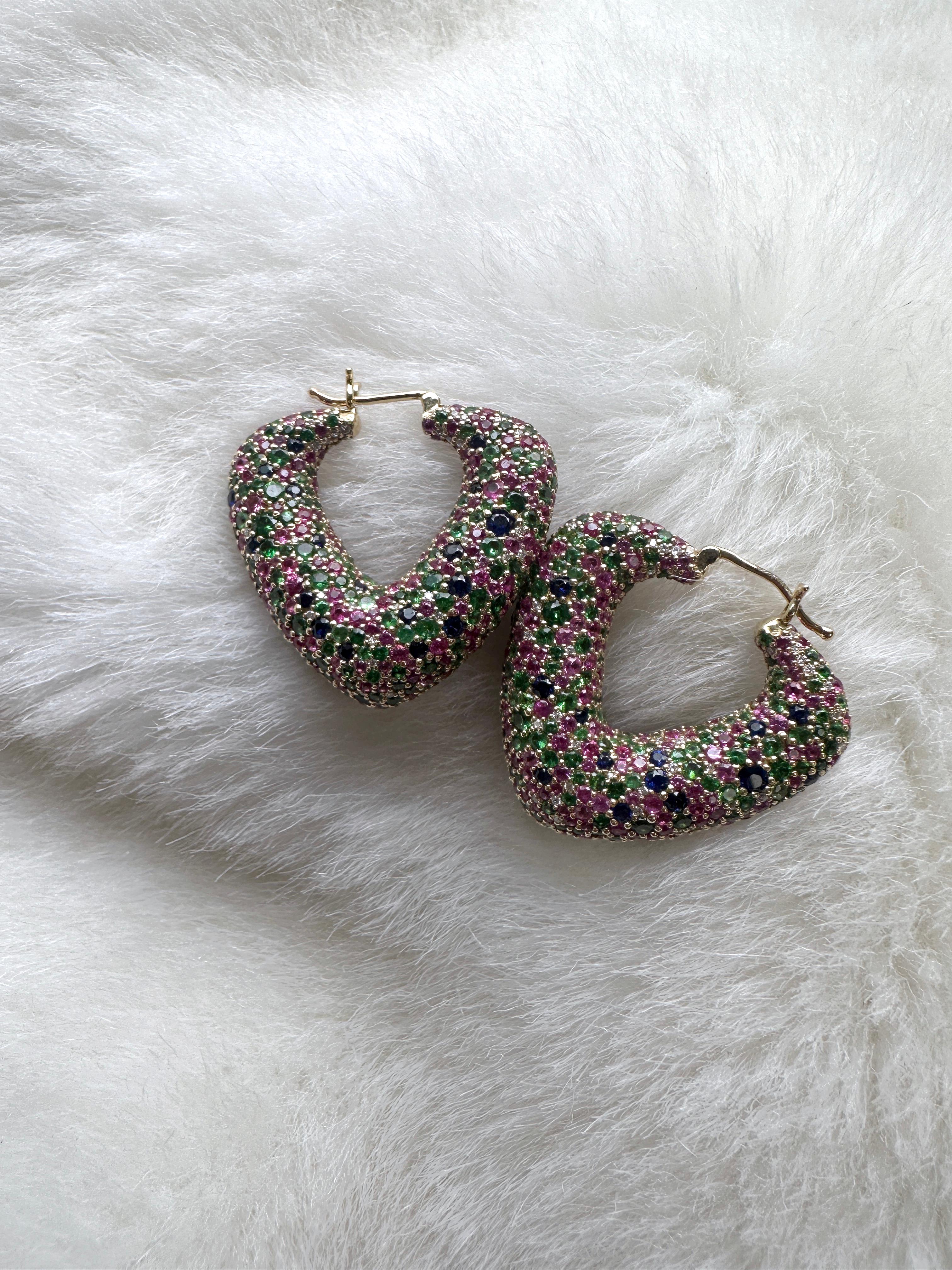 Discover sophistication and brilliance in these Multicolor Blue & Pink Sapphire with Tsavorites & Diamonds Hoop Earrings from the 'G-One' Collection. Crafted in 18K Yellow Gold, these earrings showcase a fusion of blue and pink sapphires, vibrant