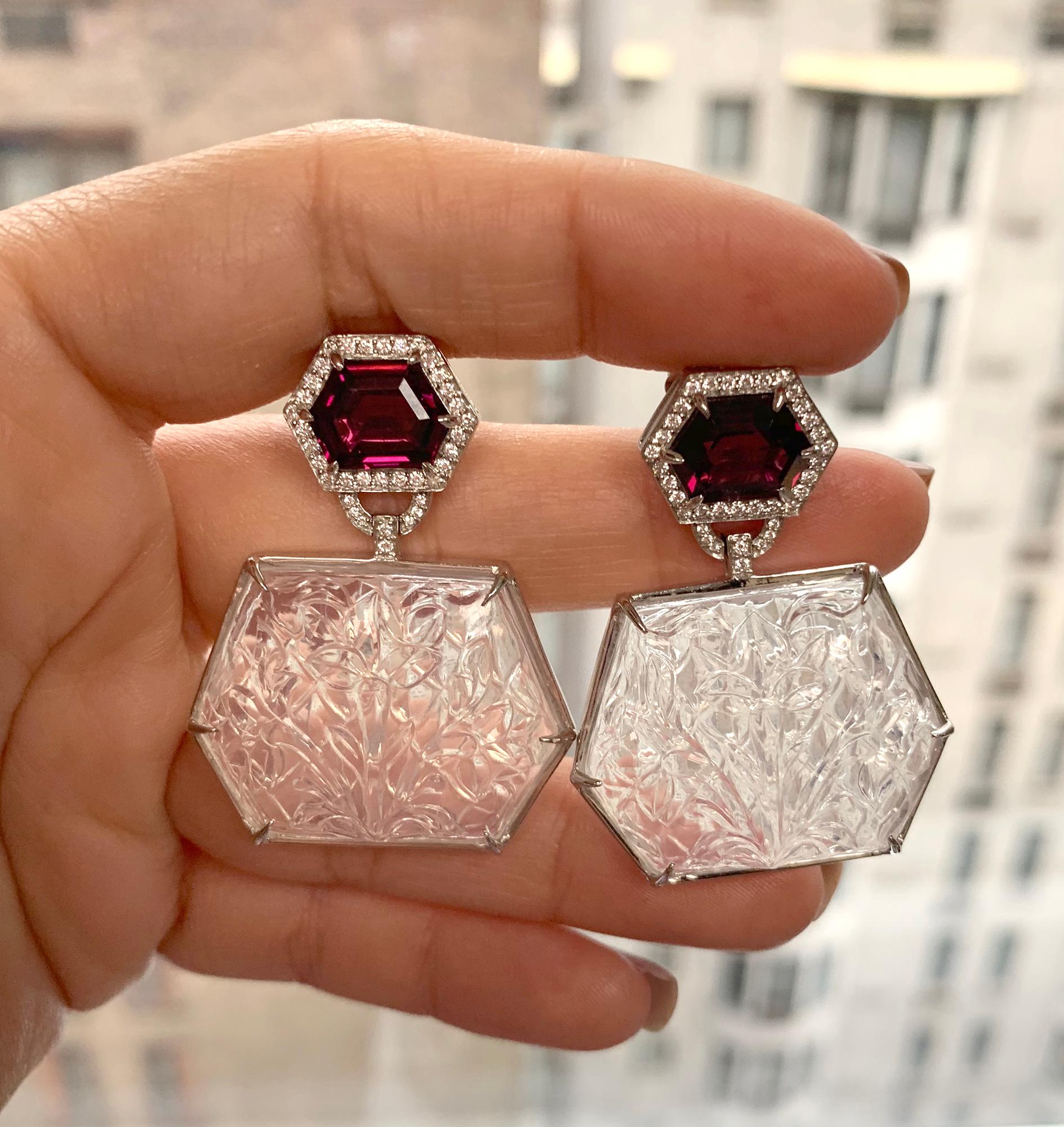 These Garnet Octagon with Moon Quartz Carved Earrings in 18K White Gold are a stunning piece from the 'G-One' Collection. These earrings feature beautifully carved moon quartz stones set in 18K white gold, which are then adorned with garnet octagon