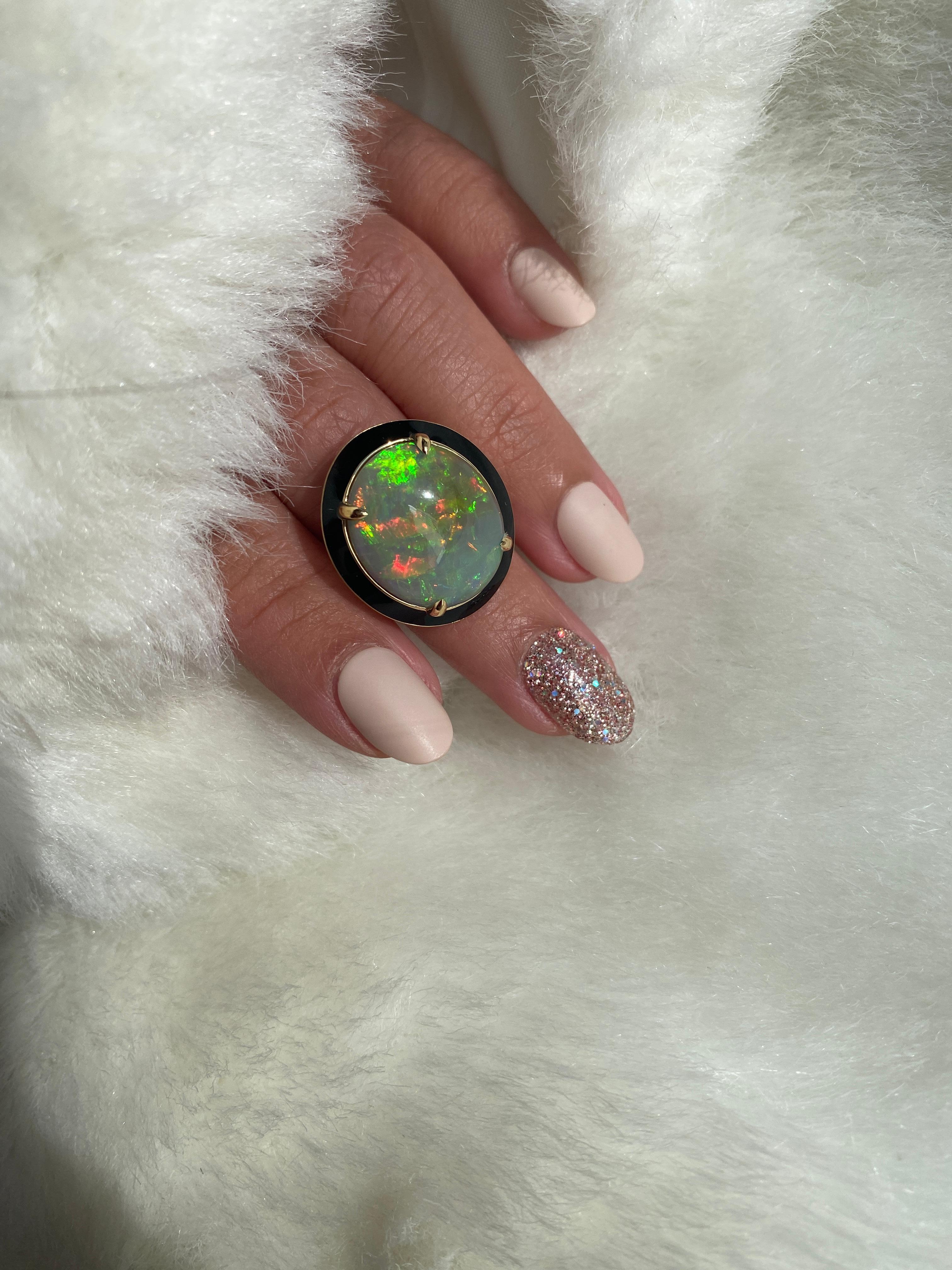 Impeccable and unique combination of Opal Cabochon with Black Enamel. Set in 18K Yellow Gold, from our ‘G-One Collection. If you want to make a statement, this is the perfect ring to do it!

* Stone size: 19 x 17 mm
* Gemstone: 100% Earth Mined 
*