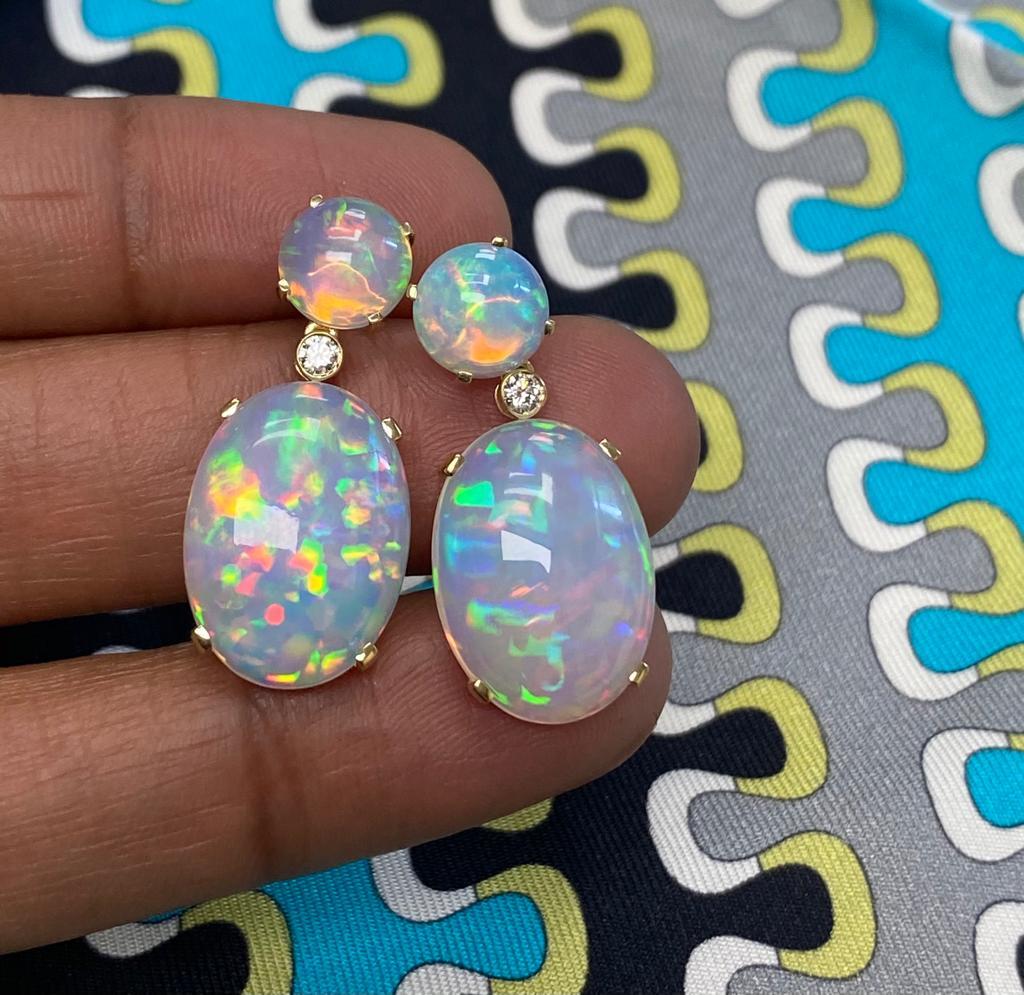 Opal Cabochon Earrings with Diamonds in 18K Yellow Gold; 'Limited Edition' 

Stone Size: 8 - 18 x 13 mm

Approx. Wt: 15.14 Carats (Opal)

Diamonds: G-H / VS; Approx. Wt: 0.12 Carats