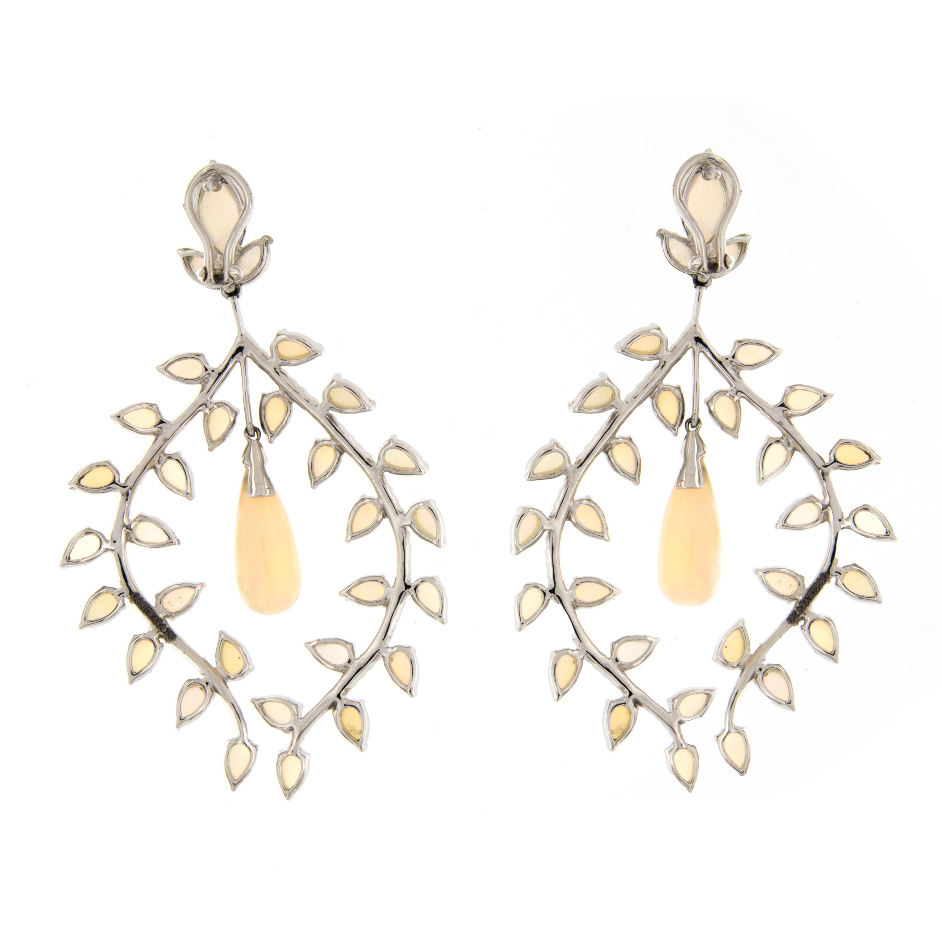 “G-One” opal and diamond chandelier earrings are truly a one of a kind piece of art, set with artistry and elegance in 18k white gold. Designed by Goshwara of New York. 2.7 inches long and 2.48 inches wide. Weigh 14 grams. Marked Goshwara.

Opal