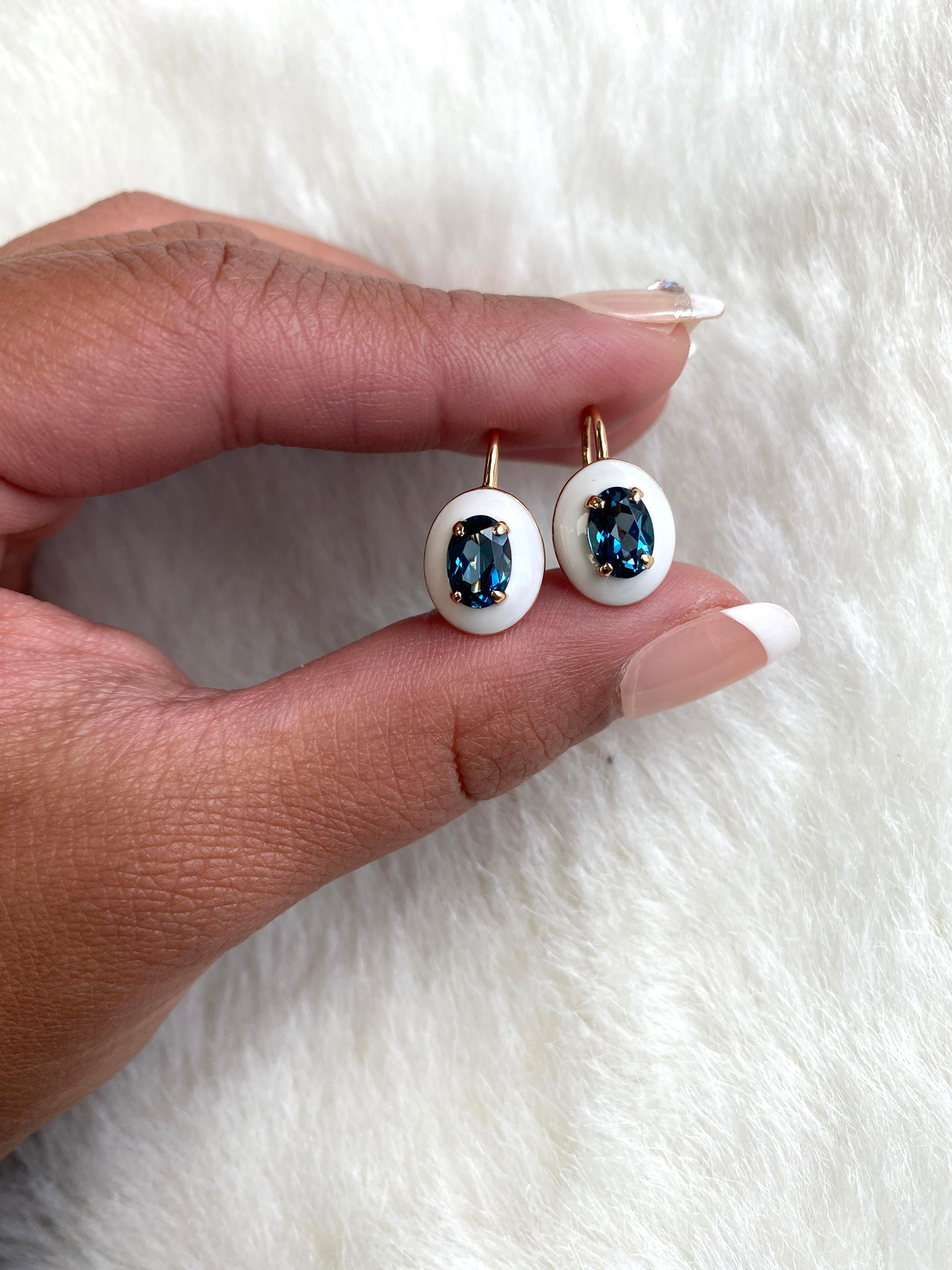 These unique earrings are a Faceted Oval London Blue Topaz, with White Enamel border and Lever back. From our ‘Queen’ Collection, it was inspired by royalty, but with a modern twist. The combination of enamel, and London Blue Topaz represents power,