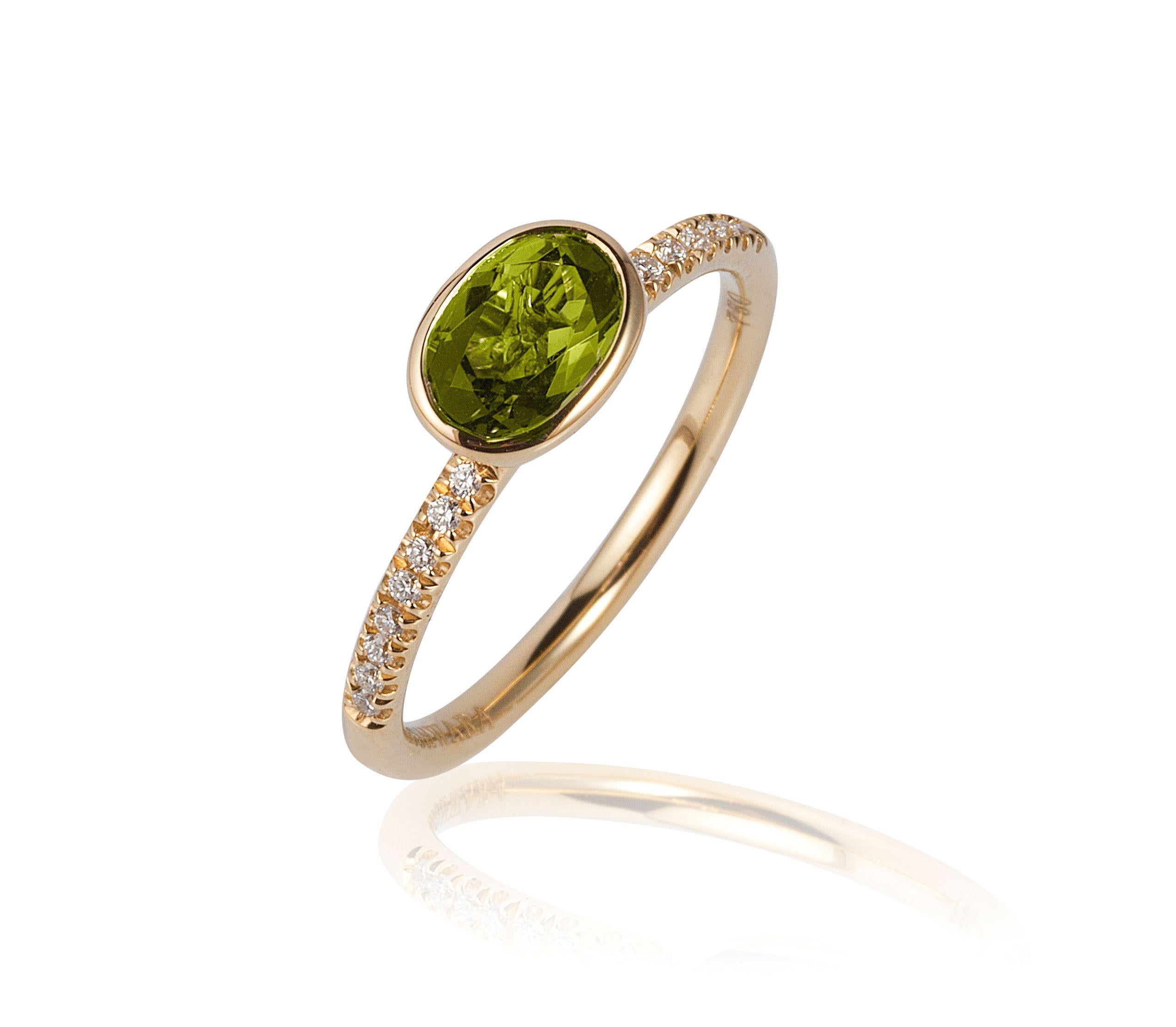 Peridot Faceted Oval Ring with Diamonds in 18K Yellow Gold, from ‘Gossip’ Collection
 
 Stone size: 7 x 5 mm
 
 Gemstone Approx. Wt: Peridot- 0.85 Carats
 
 Diamonds: G-H / VS, Approx. Wt: 0.08 Carats