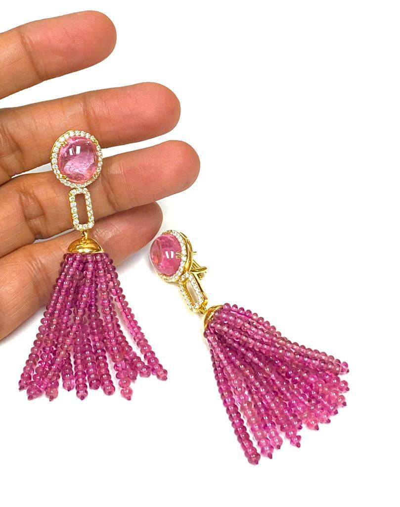 Pink Tourmaline Stud with 24 Rubellite Rows Tassel and Diamond Earrings in 18K Yellow Gold, from 'G-One' Collection

Approx. Stone Wt: 14.39 Carats (Pink Tourmaline), 84.17 Carats (Rubellite)

Diamonds: G-H /VS, Approx. Wt: 1.04 Carats