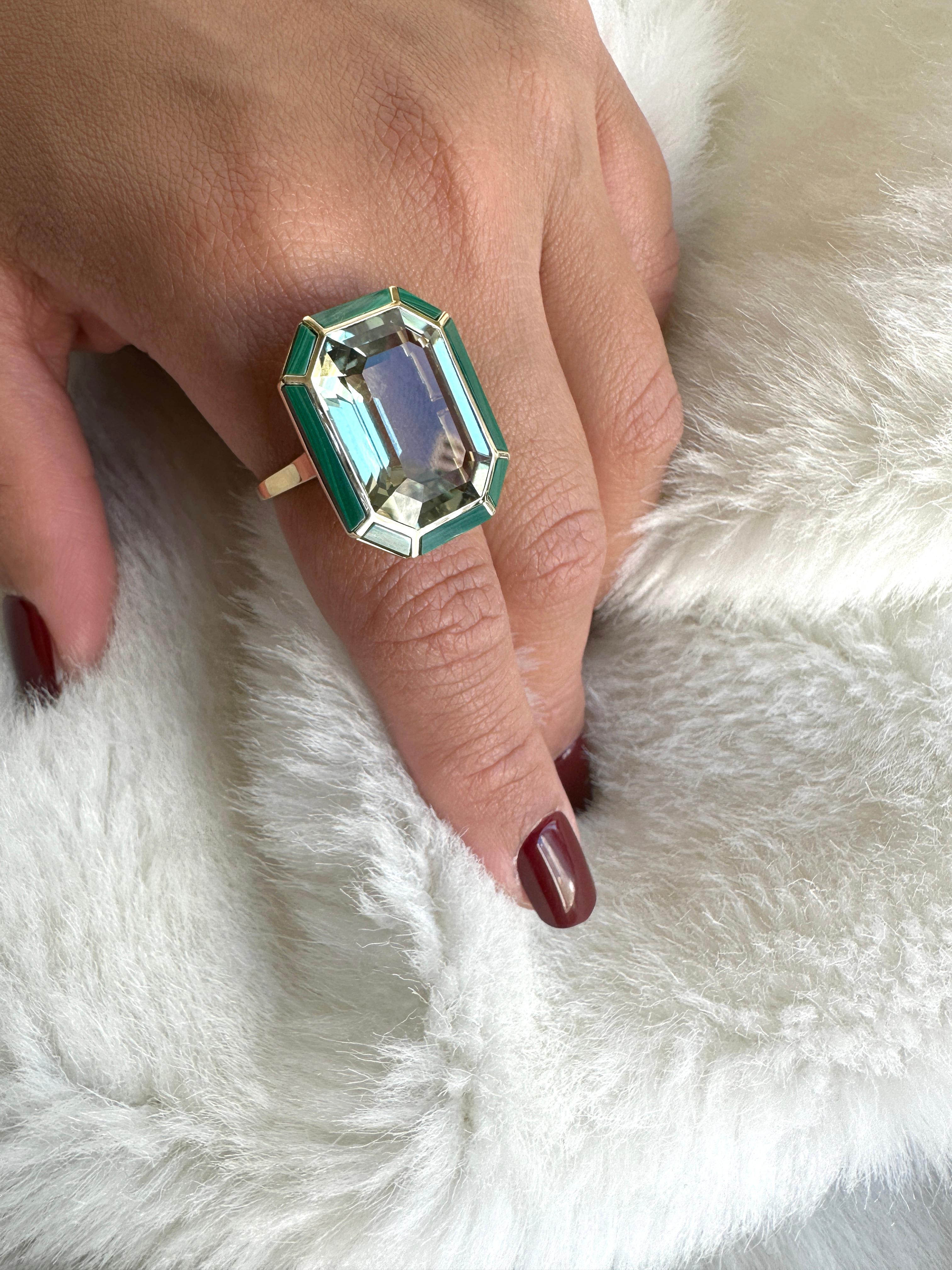 This Prasiolite and Malachite Ring from the 'Melange' Collection is an elegant and eye-catching piece of jewelry. It is crafted from 18K yellow gold and features a beautiful combination of prasiolite and malachite gemstones. Prasiolite is a green