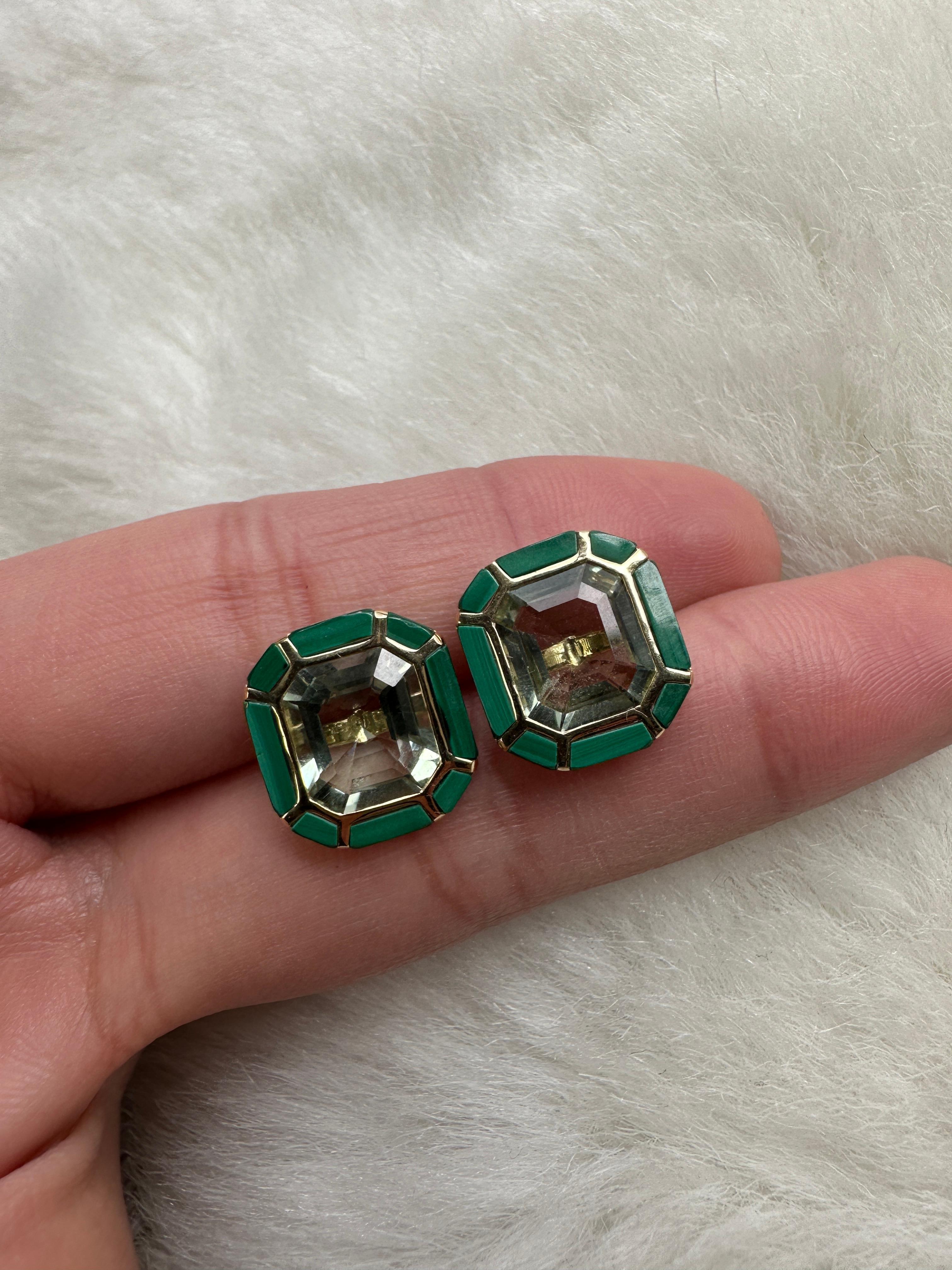 The Prasiolite & Malachite Stud Earrings from the 'Melange' Collection showcase a captivating blend of elegance and charm. Crafted with exquisite attention to detail, these earrings feature stunning emerald cut Prasiolite and Malachite gemstones set