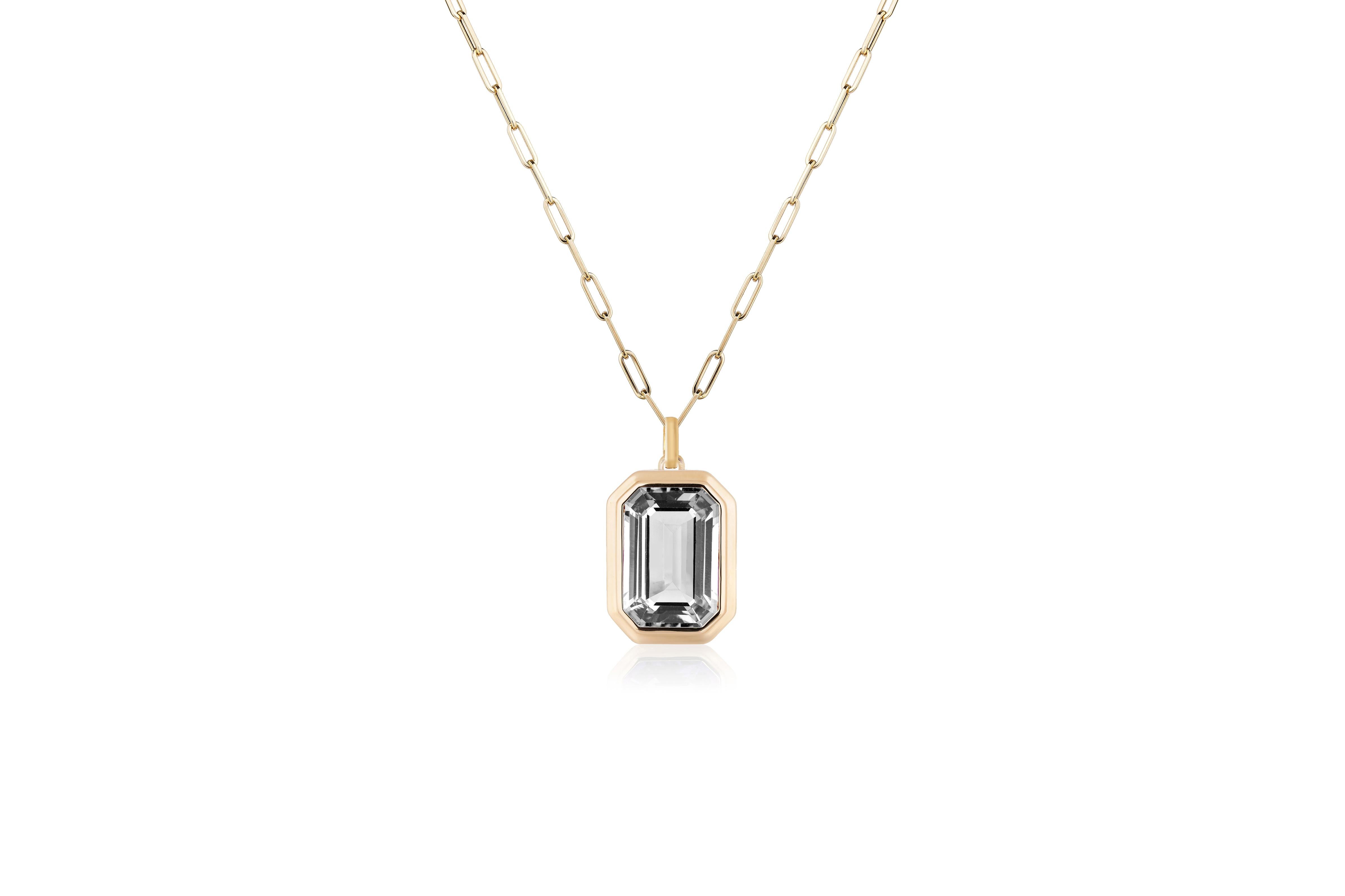 This beautiful Rock Crystal Emerald Cut Bezel Set Pendant in 18K Yellow Gold is from our ‘Manhattan’ Collection. Minimalist lines yet bold structures are what our Manhattan Collection is all about. Our pieces represent the famous skyline and