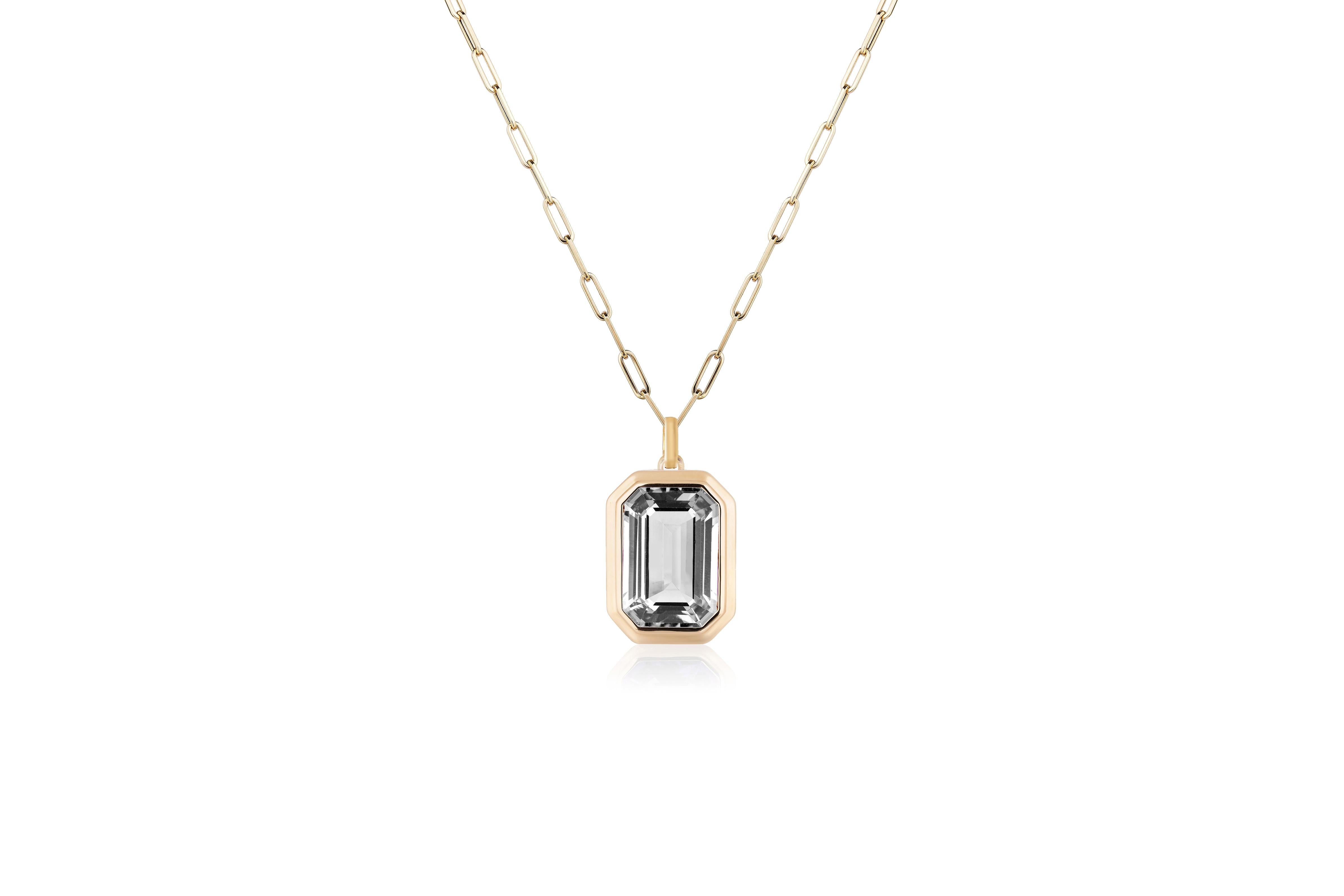 This beautiful Rock Crystal Emerald Cut Bezel Set Pendant in 18K Yellow Gold is from our ‘Manhattan’ Collection. Minimalist lines yet bold structures are what our Manhattan Collection is all about. Our pieces represent the famous skyline and