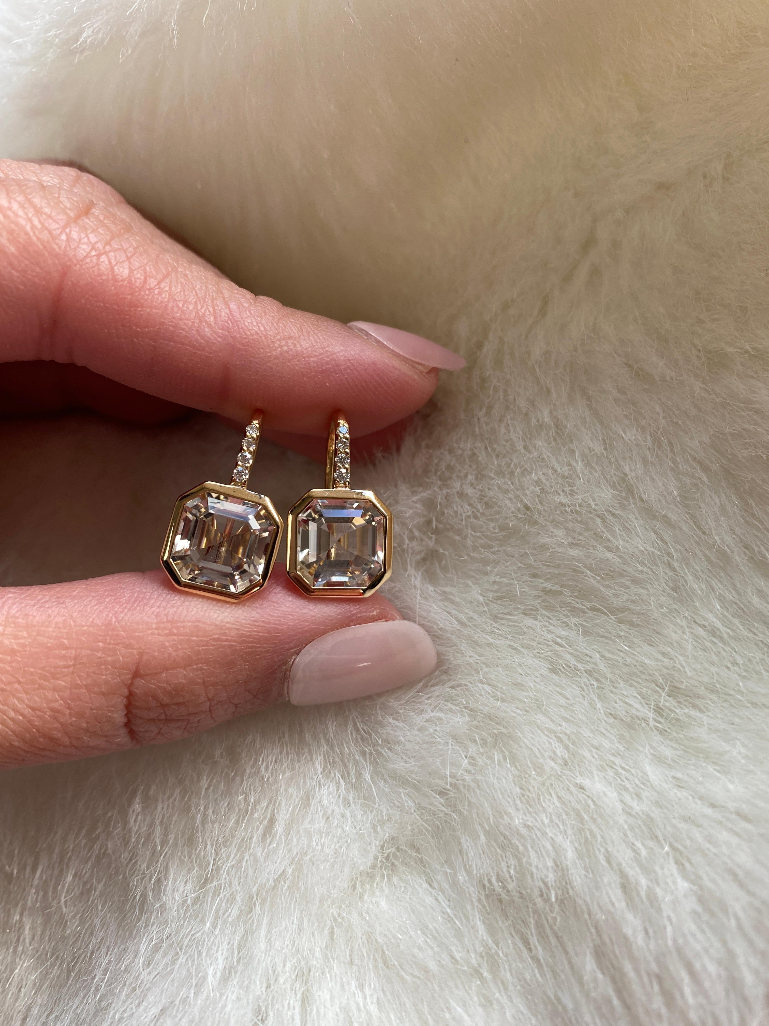Elevate your style with these exquisite earrings featuring a stunning 9 x 9 mm Asscher-cut Rock Crystal gemstone. Expertly set on a delicate wire of 18K Gold, these earrings are adorned with four dazzling Diamonds, adding a touch of luxury and