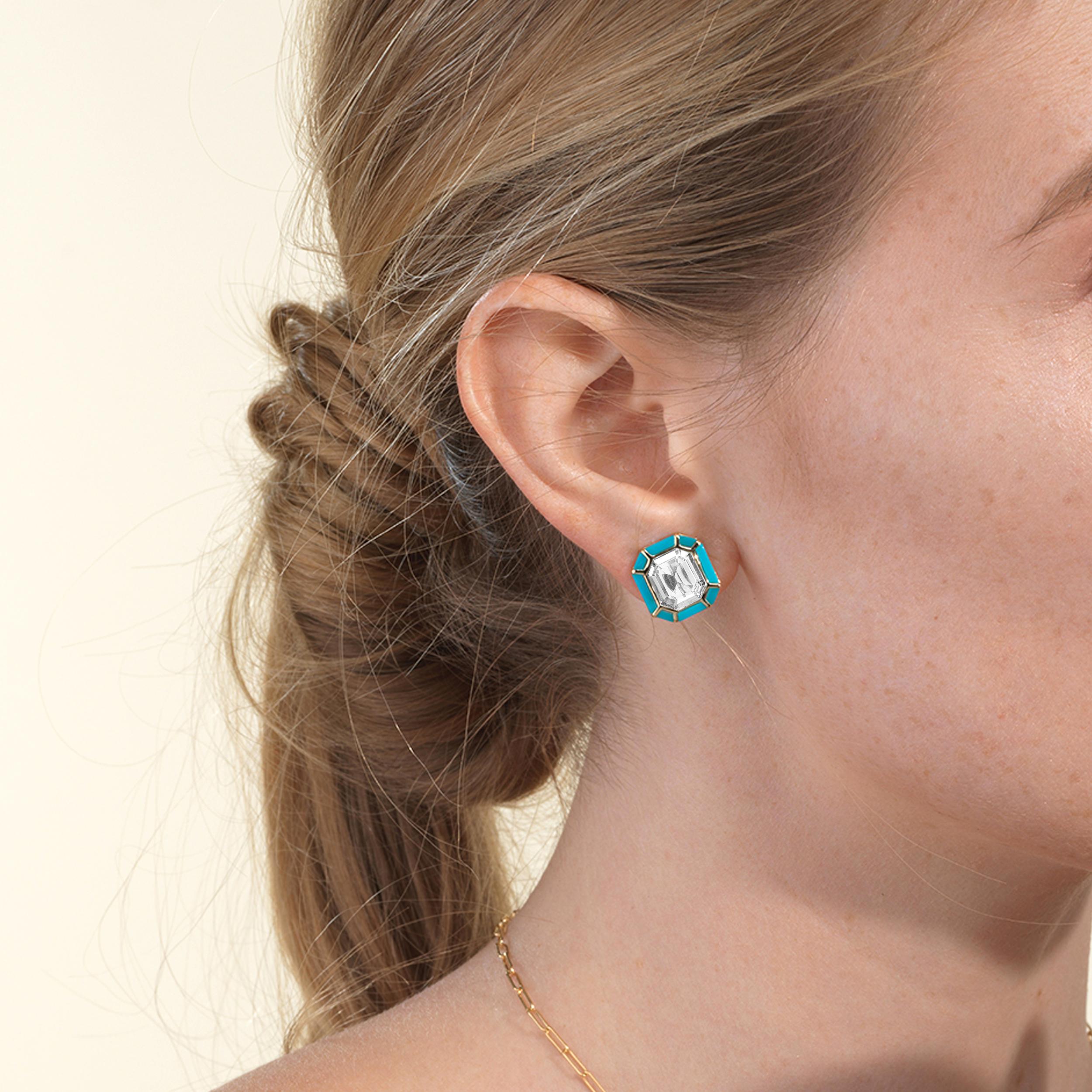 The Rock Crystal & Turquoise Stud Earrings from the 'Melange' Collection showcase a captivating blend of elegance and charm. Crafted with exquisite attention to detail, these earrings feature stunning emerald cut Rock Crystal and Turquoise gemstones