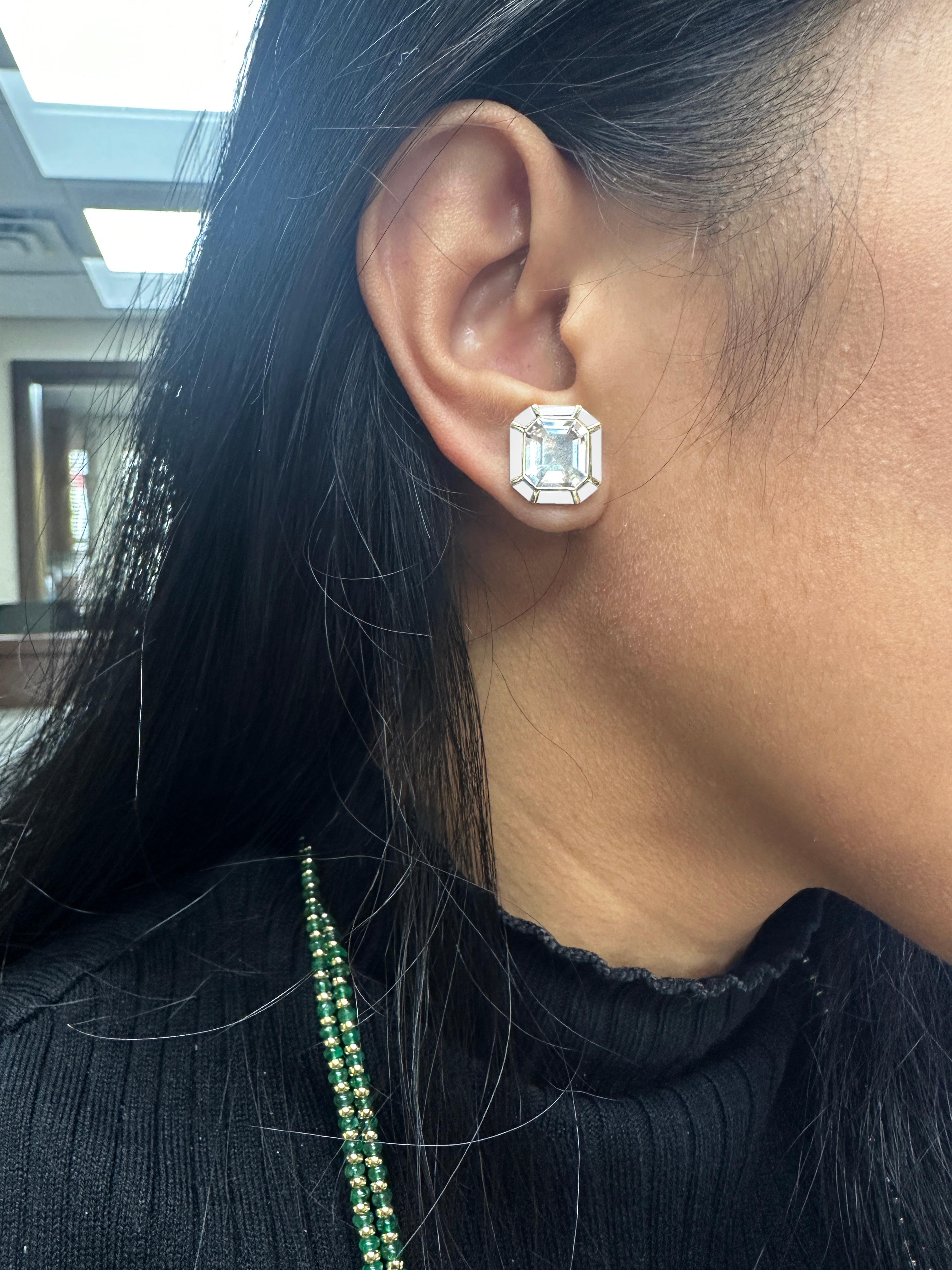 The Rock Crystal & White Agate Stud Earrings from the 'Melange' Collection showcase a captivating blend of elegance and charm. Crafted with exquisite attention to detail, these earrings feature stunning emerald cut Rock Crystal and White Agate