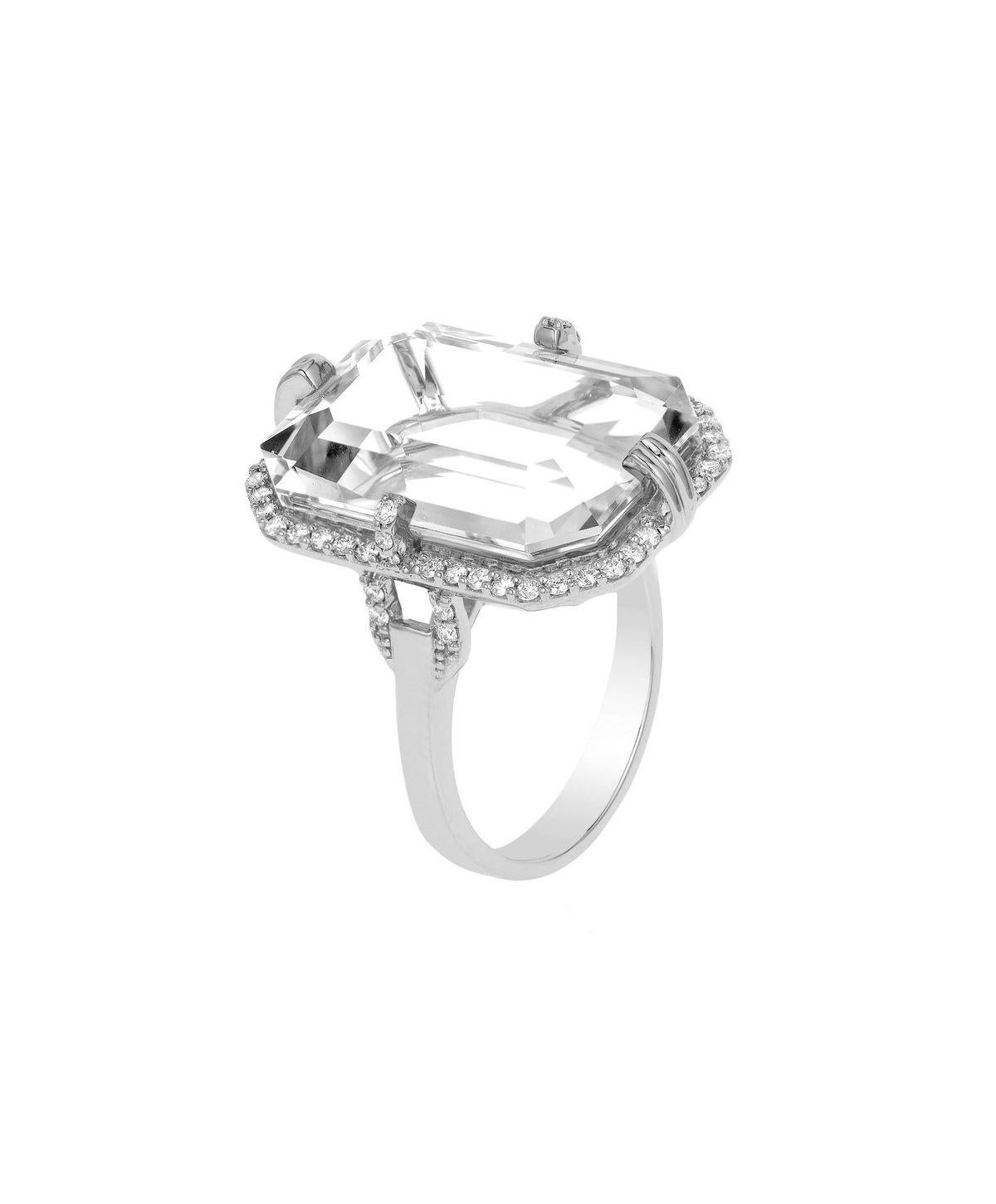 Rock Crystal Emerald Cut Ring with Diamonds in 18K White Gold, From 'Gossip' Collection

Stone Size: 20 x 14 mm 

Gemstone Approx Wt: Rock Crystal- 16.95 Carats

Diamonds: G-H / VS, Approx Wt: 0.41 Carats