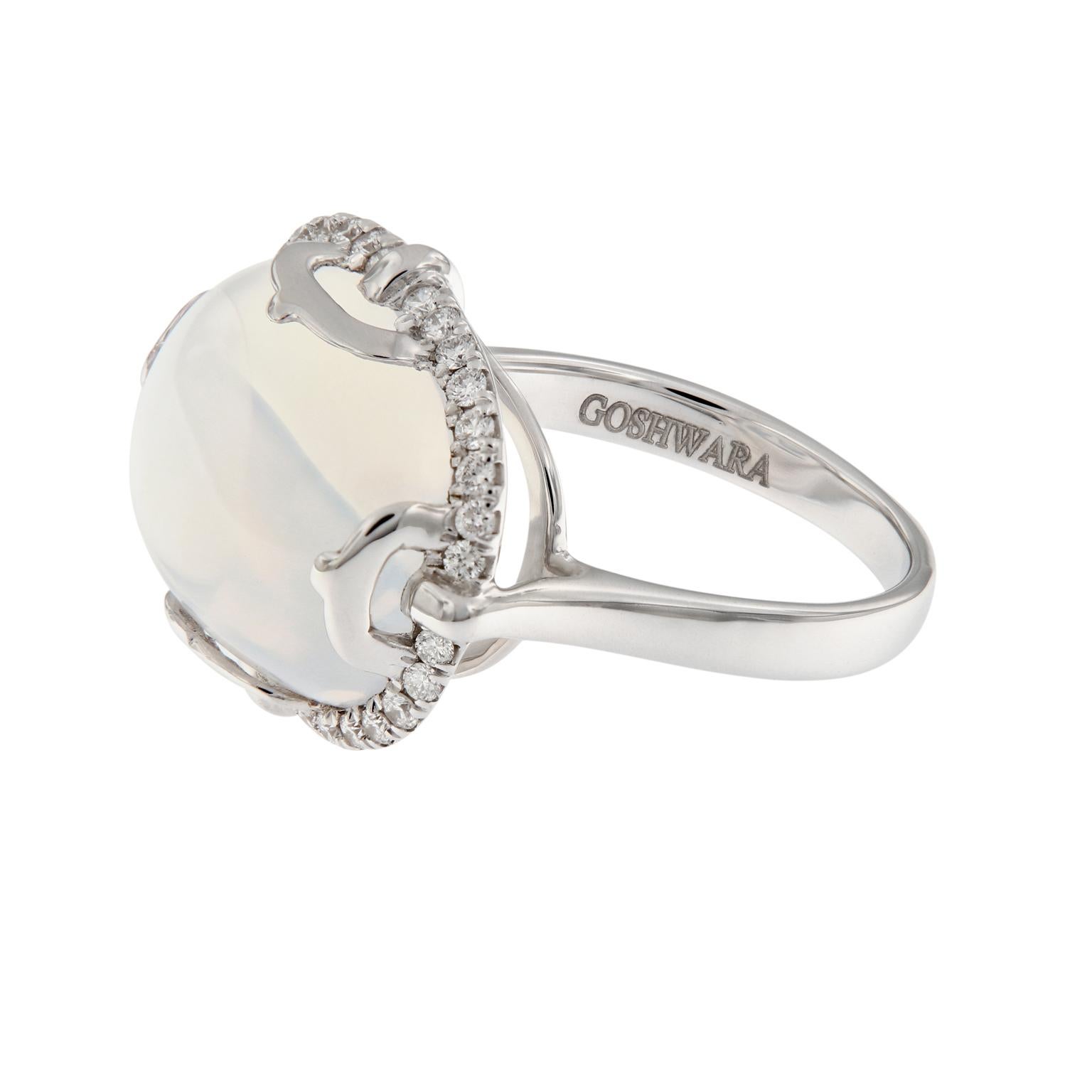 This ring centers around a 13.59 carat cabochon moon quartz and is surrounded with diamonds and crafted in 18k white gold. The ring is from the Rock-N-Roll Collection designed by Goshwara. Top of ring measures 17 mm x 21 mm. Ring size 6.75. Weighs