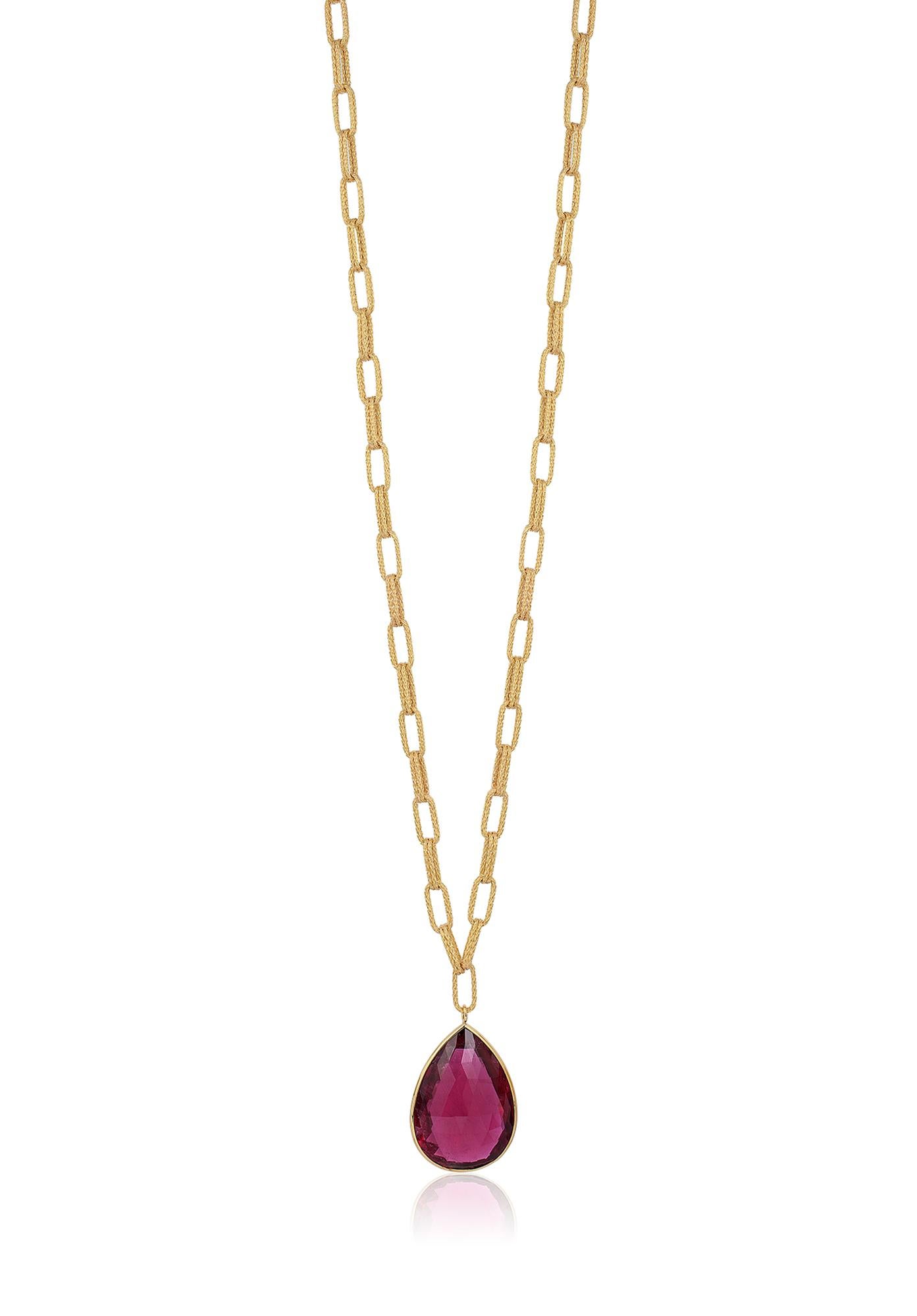 This Rubelite Briolette with Large Textured Flat Chain Necklace in 18K Yellow Gold is a stunning piece of jewelry from the 'G-One' collection. This necklace features a beautiful Rubelite Briolette, which is a type of gemstone that is prized for its