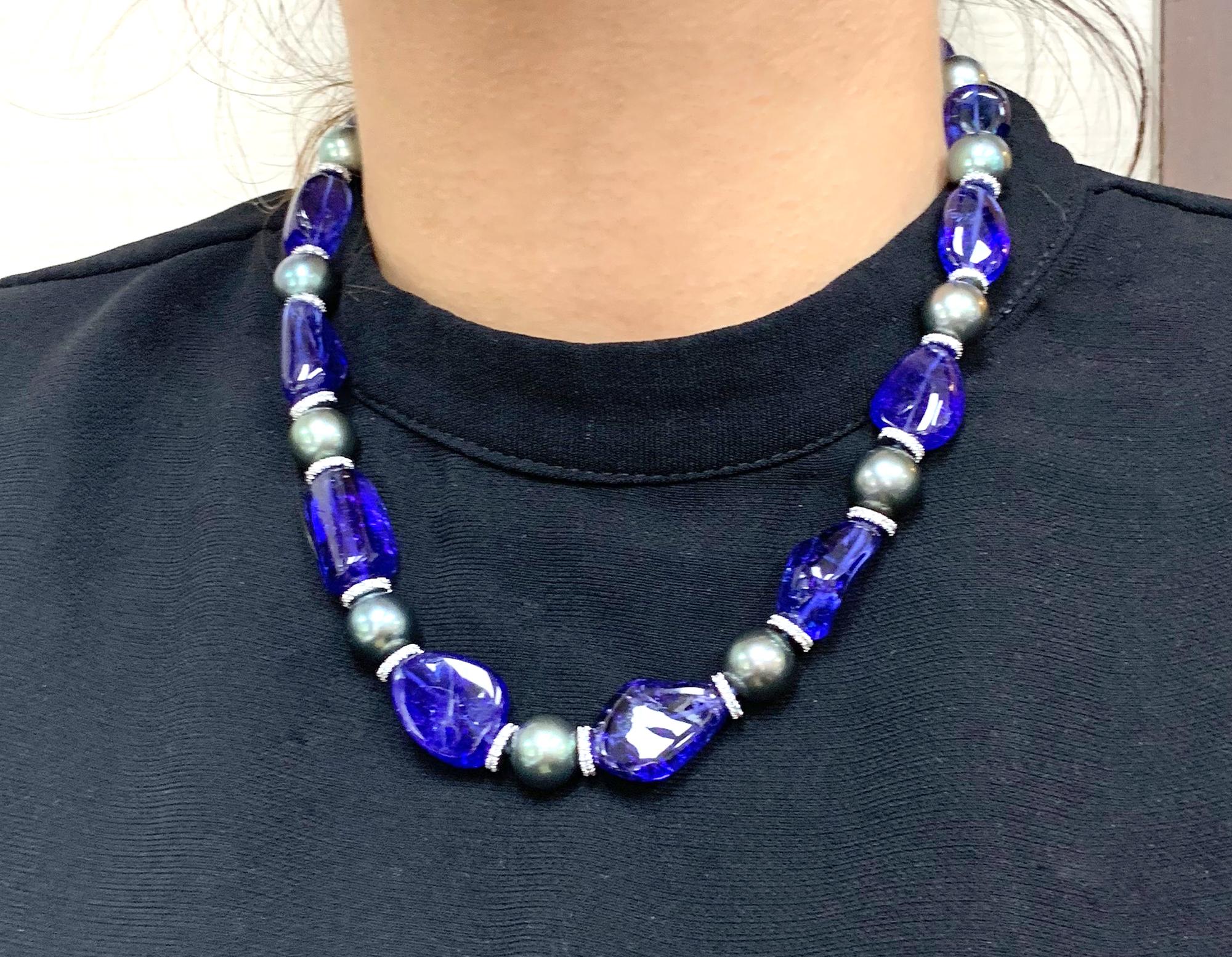 This Tanzanite Tumbled Beads & South Sea Pearls with Diamonds Rondel Necklace in 18K White Gold is a stunning piece of jewelry from the 'G-One' Collection. The necklace features beautiful tanzanite tumbled beads and lustrous South Sea pearls,