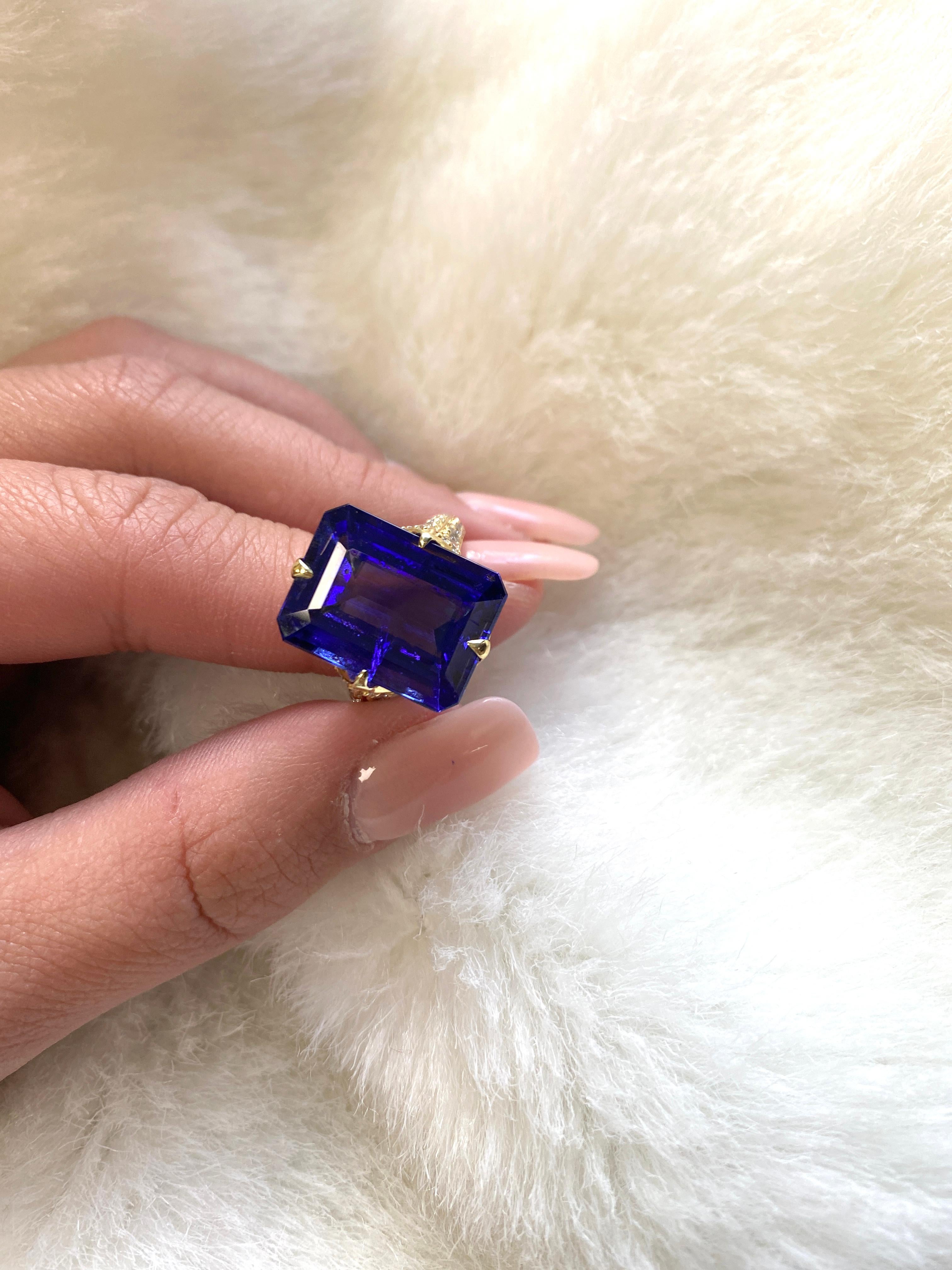 Stunning Tanzanite Emerald Cut Ring with Diamonds in 18K Yellow Gold, from ‘G-One' Collection. This is the perfect ring to make a statement. You will dazzle even more wearing it!

* Stone size: 16.80 x 12.80 mm
* Gemstone: 100% Earth Mined 
*