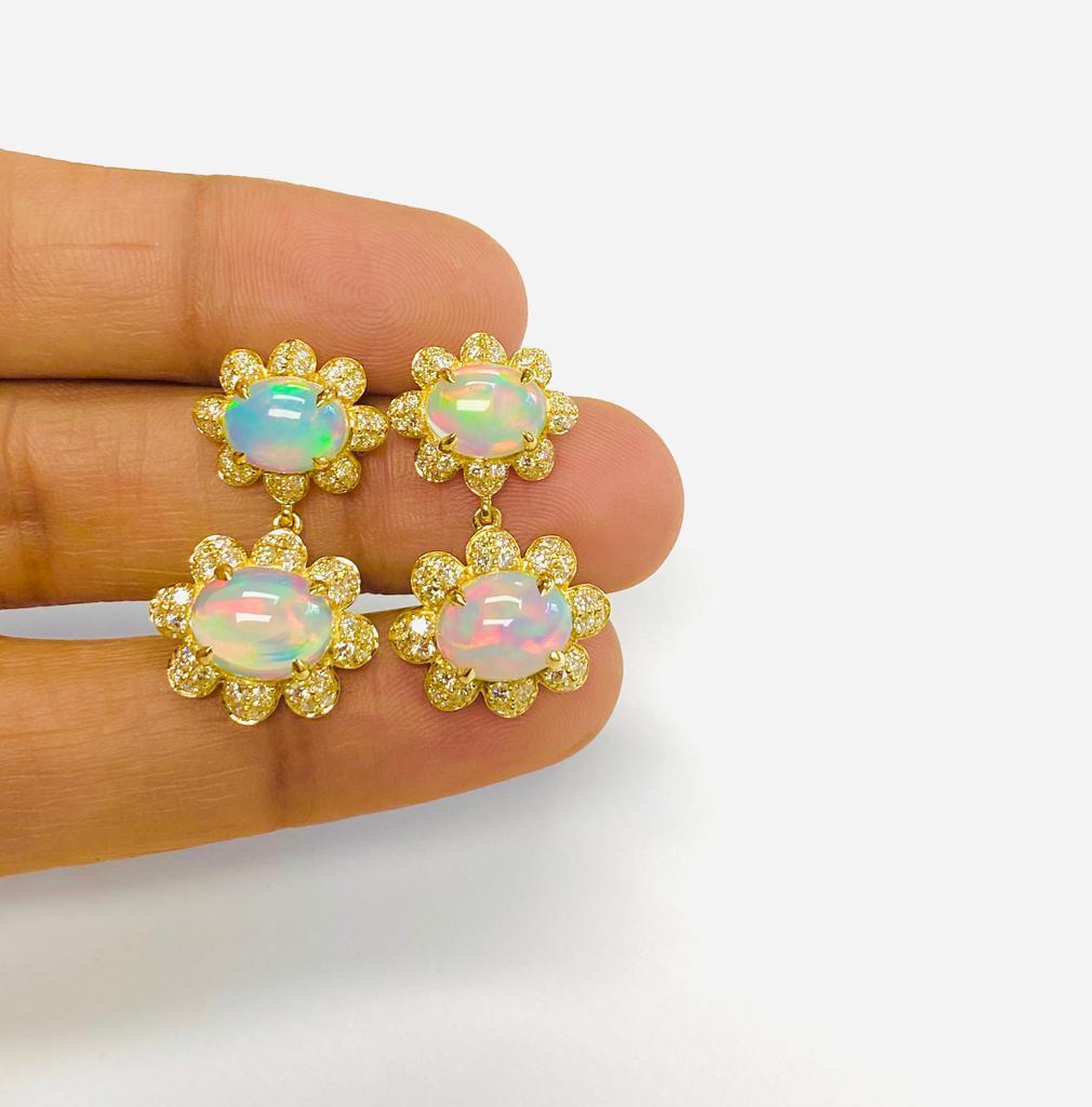 Twin Opal Cabochon Earrings with Diamonds in 18K Yellow Gold, 'Limited-Edition'  

Stone Size: 9 x 7 & 10 x 8 mm

Approx. Stone Wt: 5.46 Carats (Opal)

Diamonds: G-H / VS, Approx. Wt: 1.39 Carats 