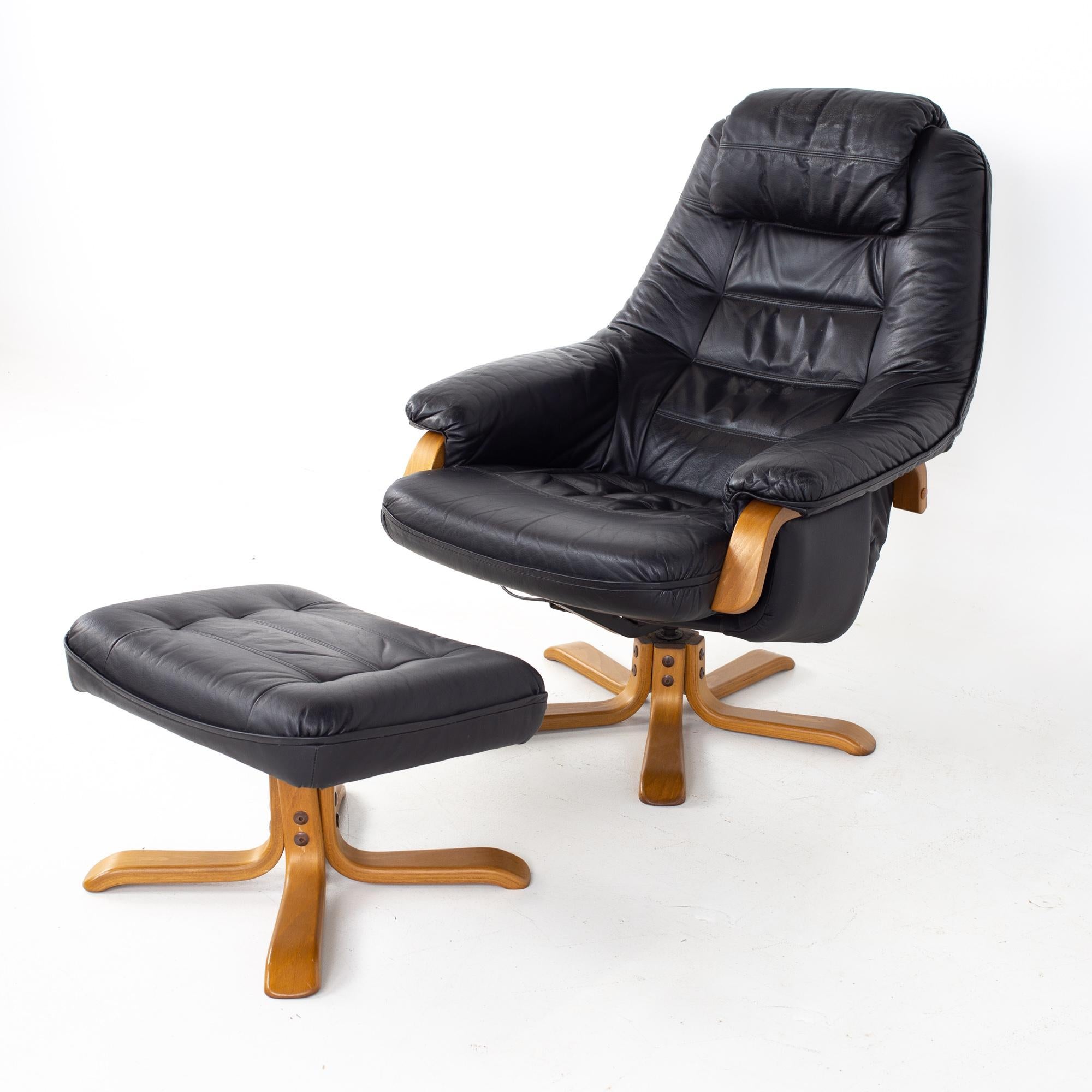 Gote Mobler mid century Swedish black leather swivel lounge chair and ottoman
Lounge chair measures: 31.5 wide x 36 deep x 39 high, with a seat height of 17 inches
Ottoman measures: 21.5 wide x 17.5 deep x 14 inches high

All pieces of furniture