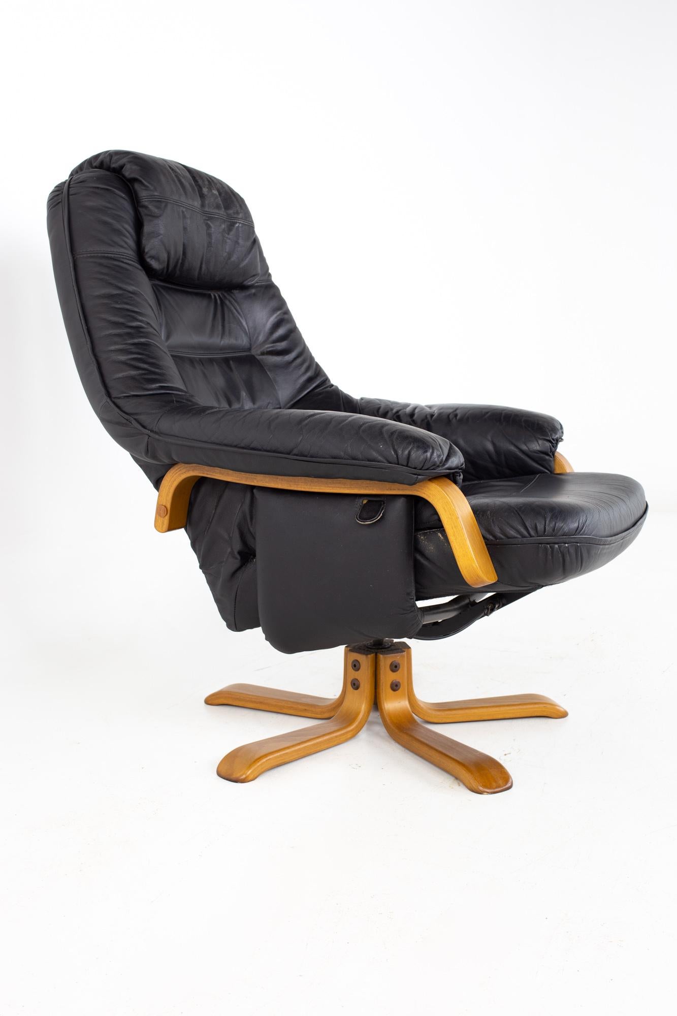 Late 20th Century Gote Mobler Mid Century Swedish Black Leather Swivel Lounge Chair and Ottoman