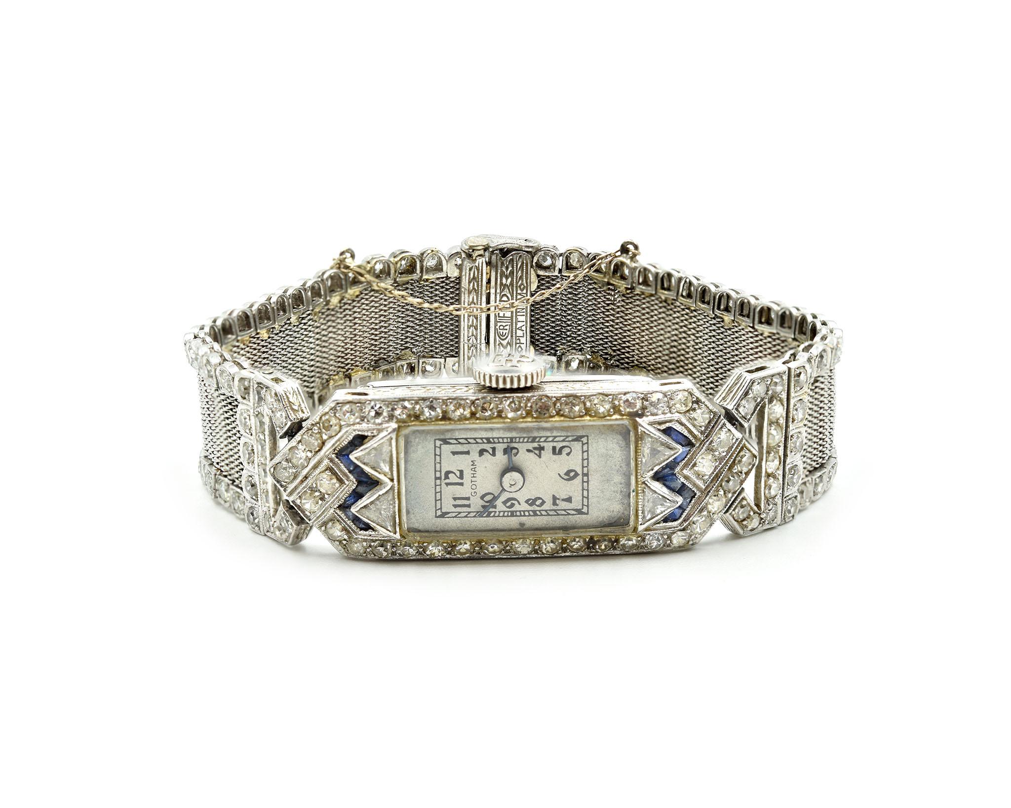 Movement: mechanical 17 jewel movement
Function: hours, minutes
Case: rectangular 37.39mm x 13.36mm platinum diamond set case, domed plastic crystal, winding crown
Diamonds: 134 round brilliant cuts = 1.69 carat total weight
Dial: grey arabic