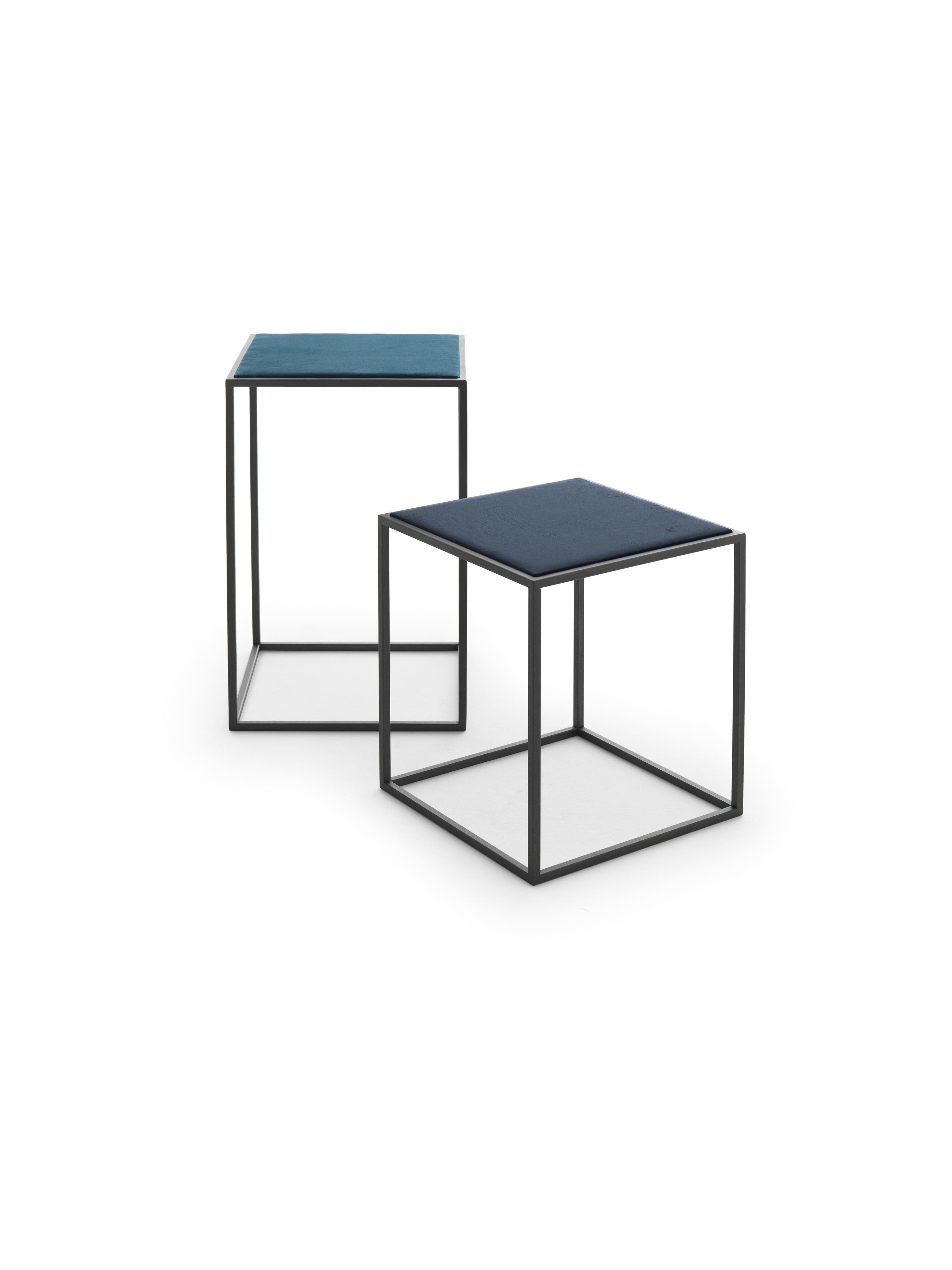 The Gotham side table/nightstand is simple, compact, rich and soft all at once. The base is made with a very thin squared metal tubing which results in a physically and visually light geometric structure. The top is upholstered in velvet to create a