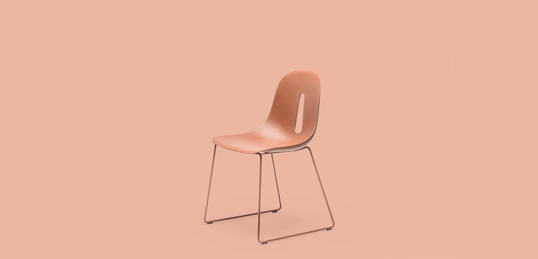 Terracotta powder-coated sled metal base supports a rigid polyurethane Tech shell in terracotta color. Gotham's design features a distinct graphic detail, resembling a raindrop, adding uniqueness without excess. Conceived by Dario Delpin in 2010,