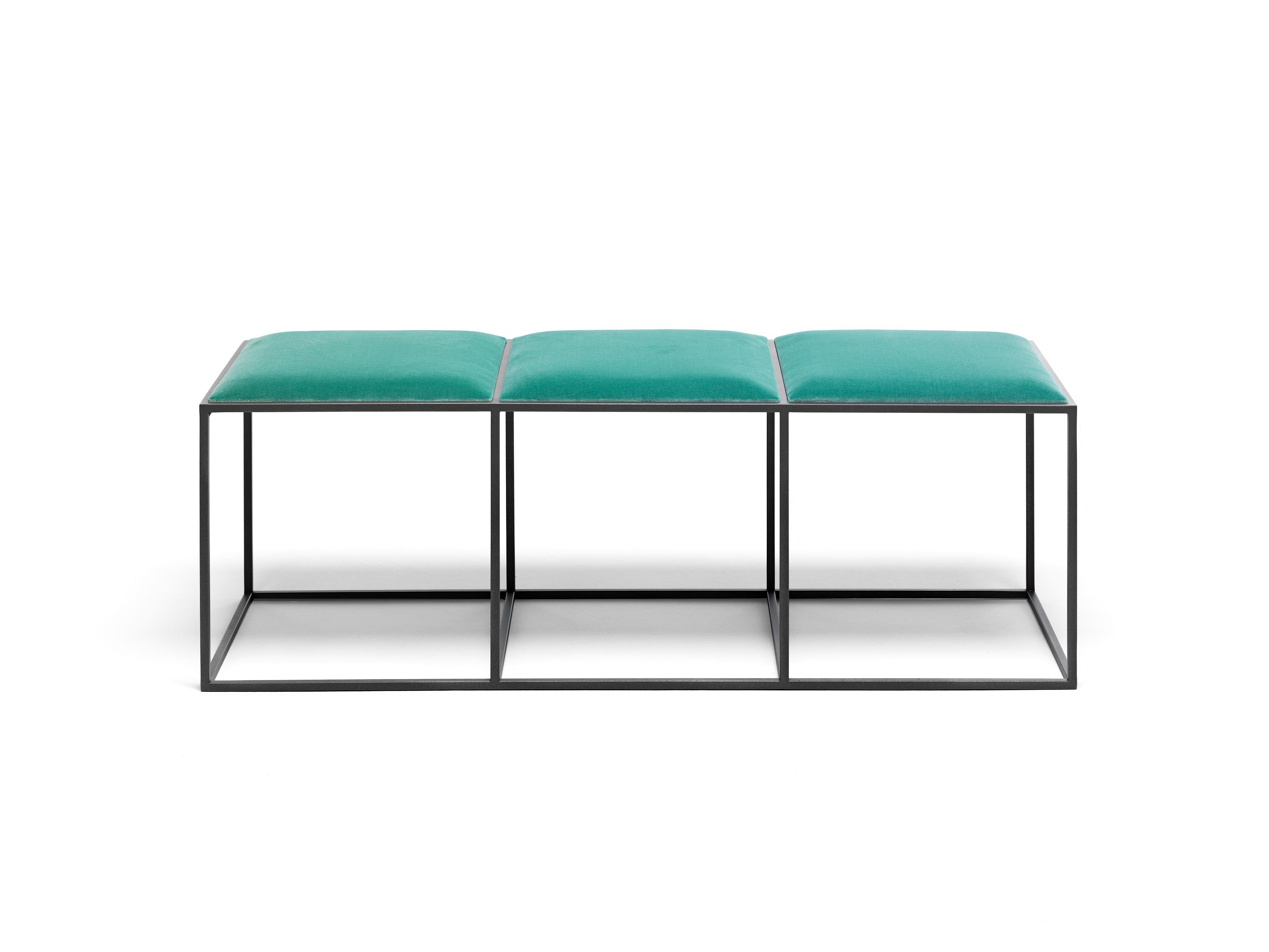 A small bench, simple, compact and extremely light, designed to be placed at the end of the bed but versatile enough to go anywhere. The base is made with a very thin squared metal tubing which results in physically and visually light and clean