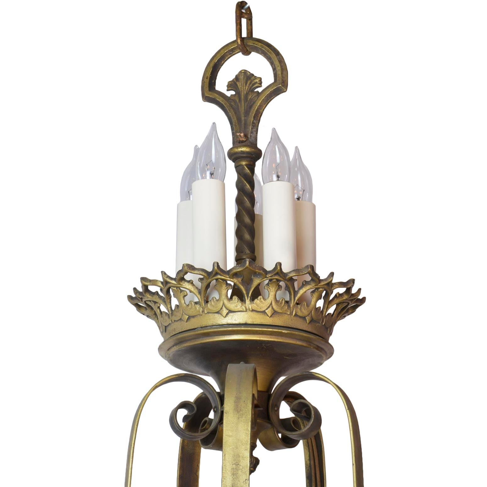 Gothic chandelier featuring quatrefoils, trefoils, acanthus leaf, scrollwork, and fleur-de-lis details, with 15 candles around the body and 5 candles at the top.

We find that early antique lighting was designed as objects of art and we treat each