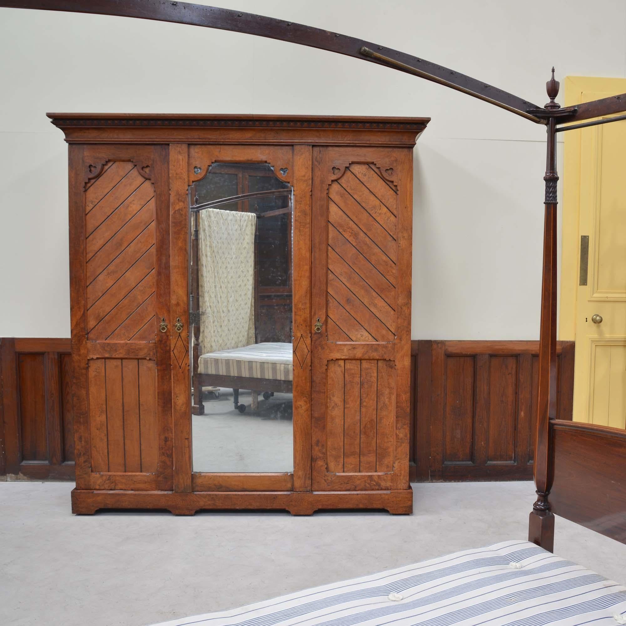 English Gothic antique brown oak wardrobe by Marsh, Jones & Cribb For Sale
