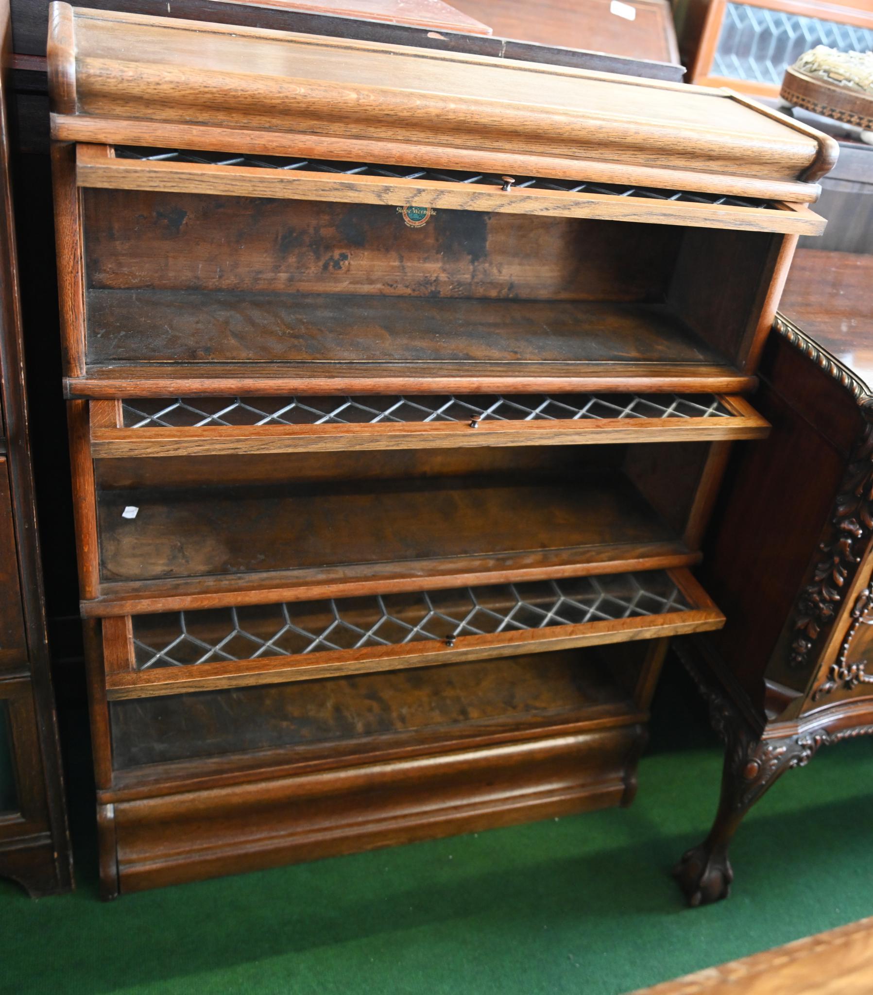 Three tier oak Globe Wernicke bookcase with lift up leaded glass panel in the Gothic style
Circa 1890
The Globe-Wernicke bookcase is a modular, stackable barrister bookcase known for its distinctive glass-fronted sections that lift and slide back