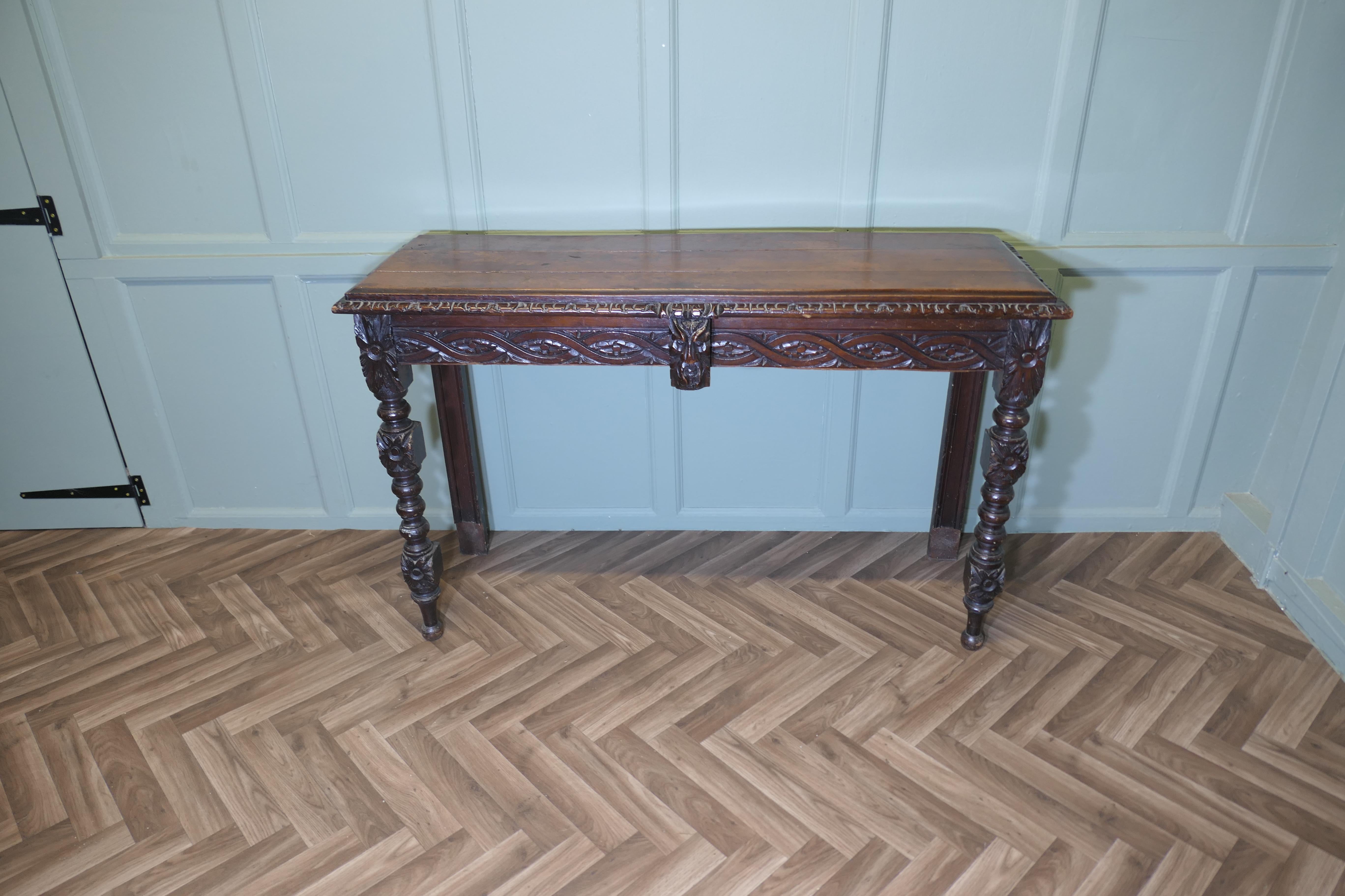 Gothic Carved Country Oak Hall Table
The table is made in Oak, it has a carved border at the top , very attractive turned and carved legs, and a mask of the green man at the centre This table is a good piece of country furniture, it is in good sound