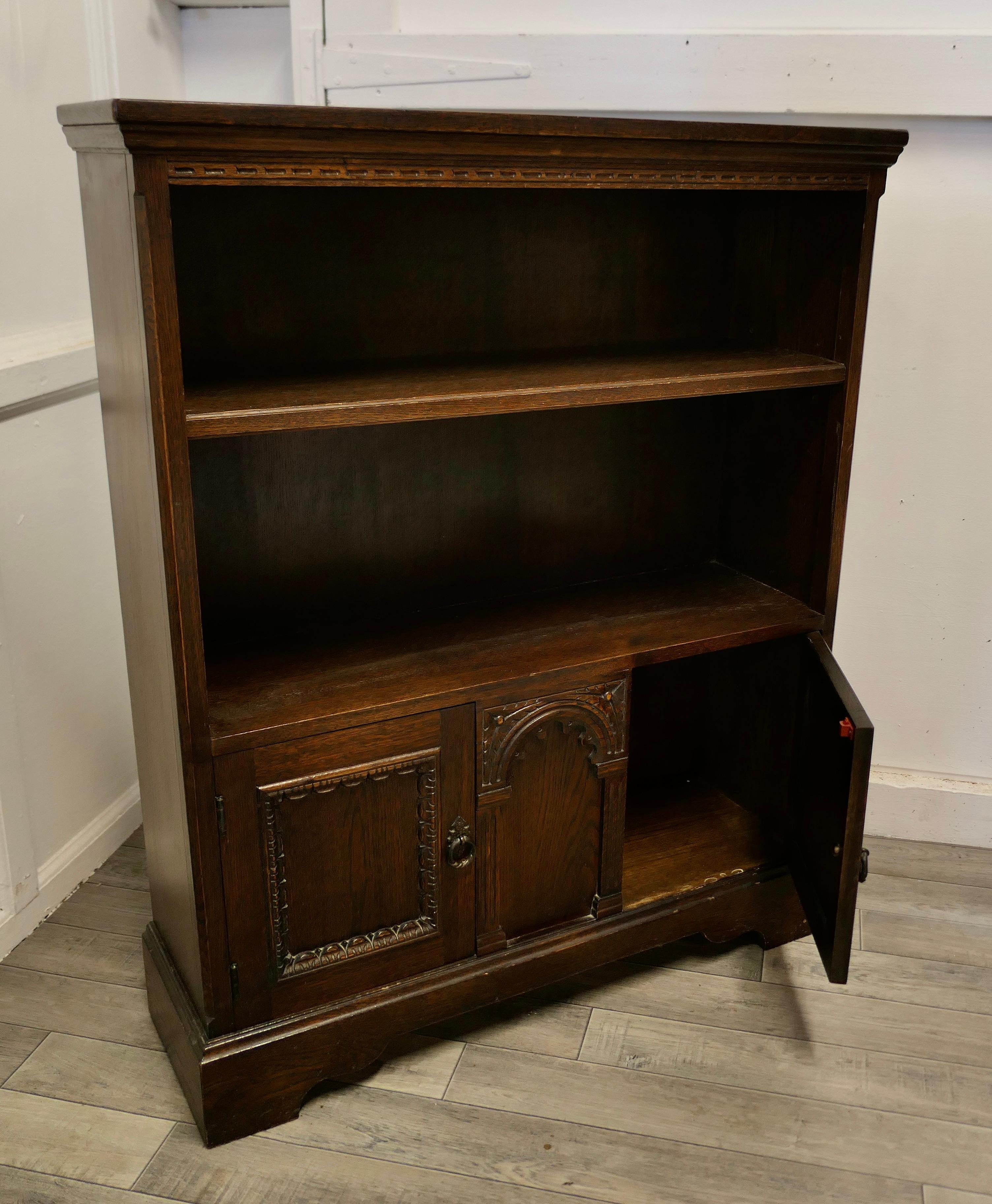 Mid-20th Century Gothic Carved Oak Open Bookcase with Cupboard by Old Charm For Sale