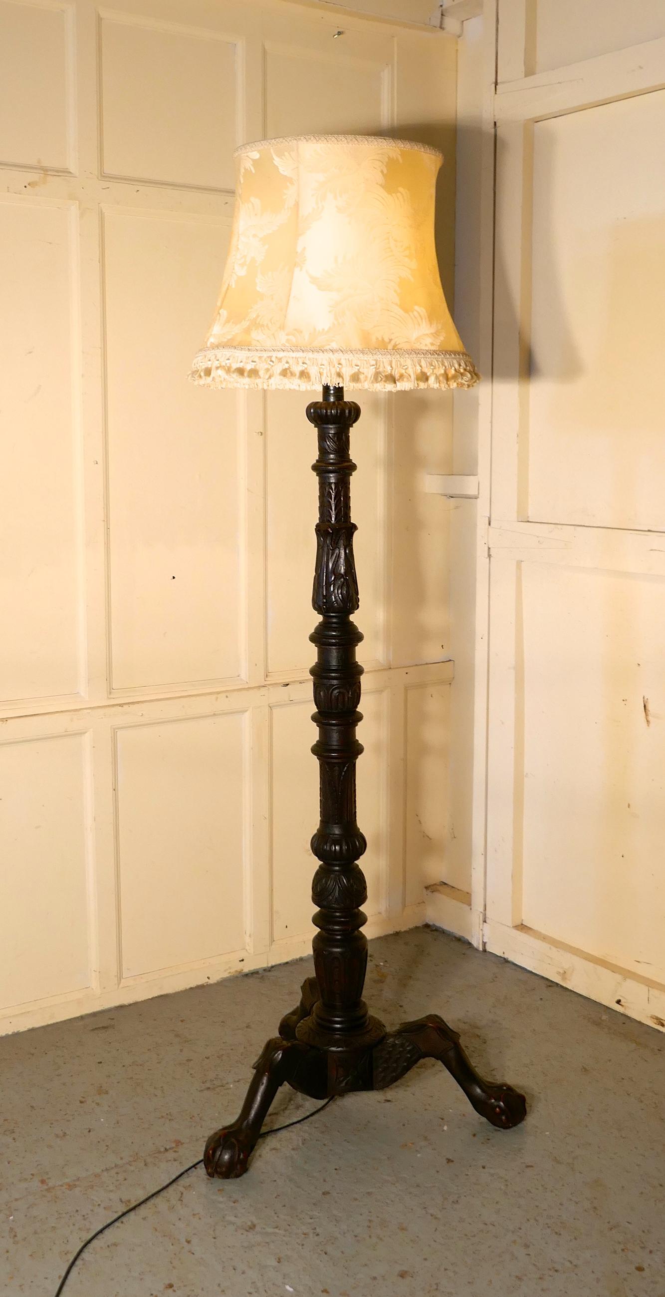 Gothic carved oak torchere, floor standing standard lamp

 A skilfully carved piece of Oak, the lamp has been made from a carved torchere stands on carved 3 footed base with detailed hairy paw feet 
The lamp is in very good condition, it has good