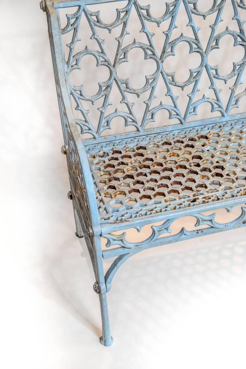 Cast iron Gothic pattern garden bench, decorated with a trefoil and quatrefoil reticulated back. Painted in the last 20 years.