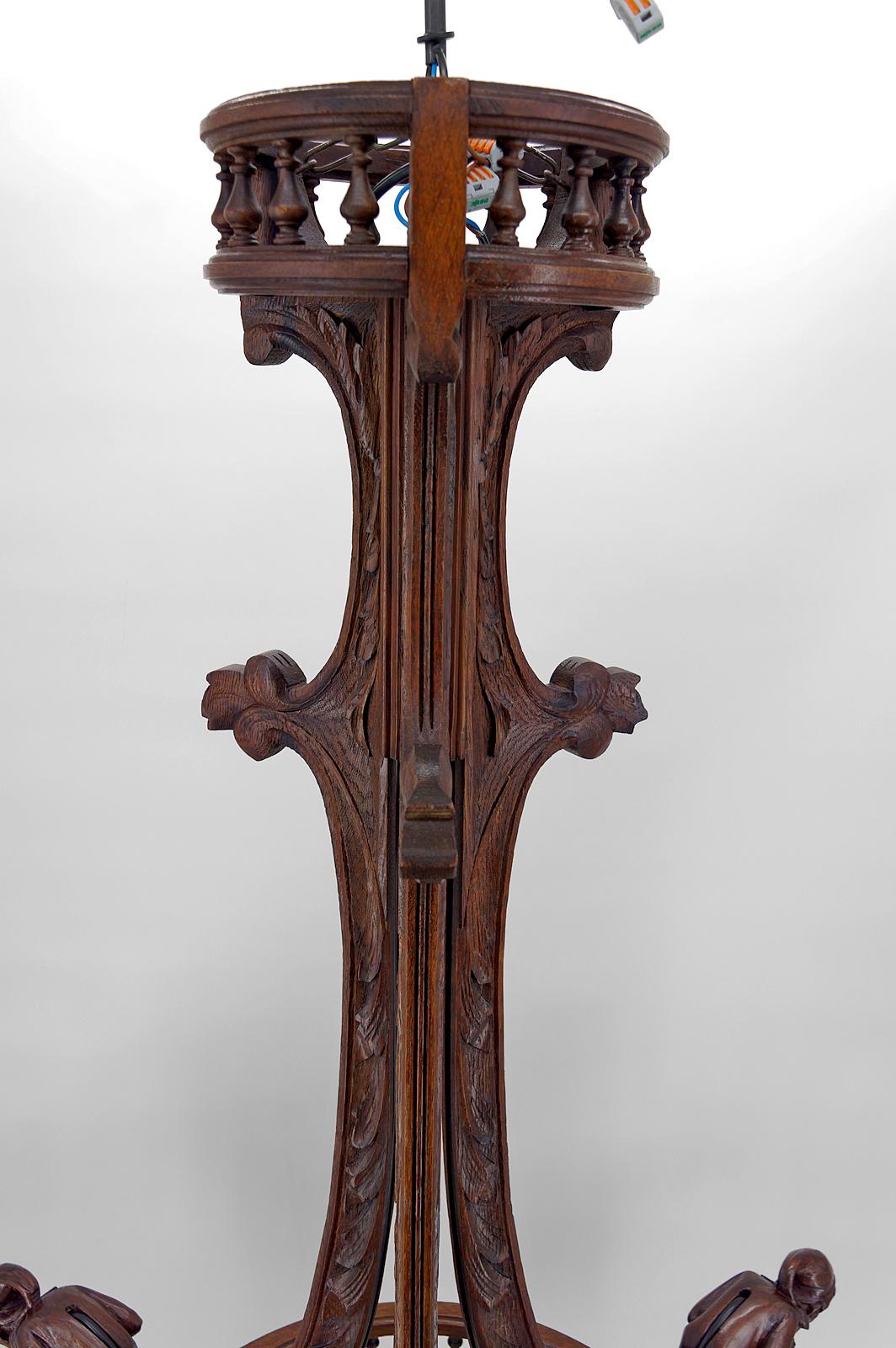Gothic Chandelier Carved with Jesters and Lanterns, France, circa 1900 For Sale 11