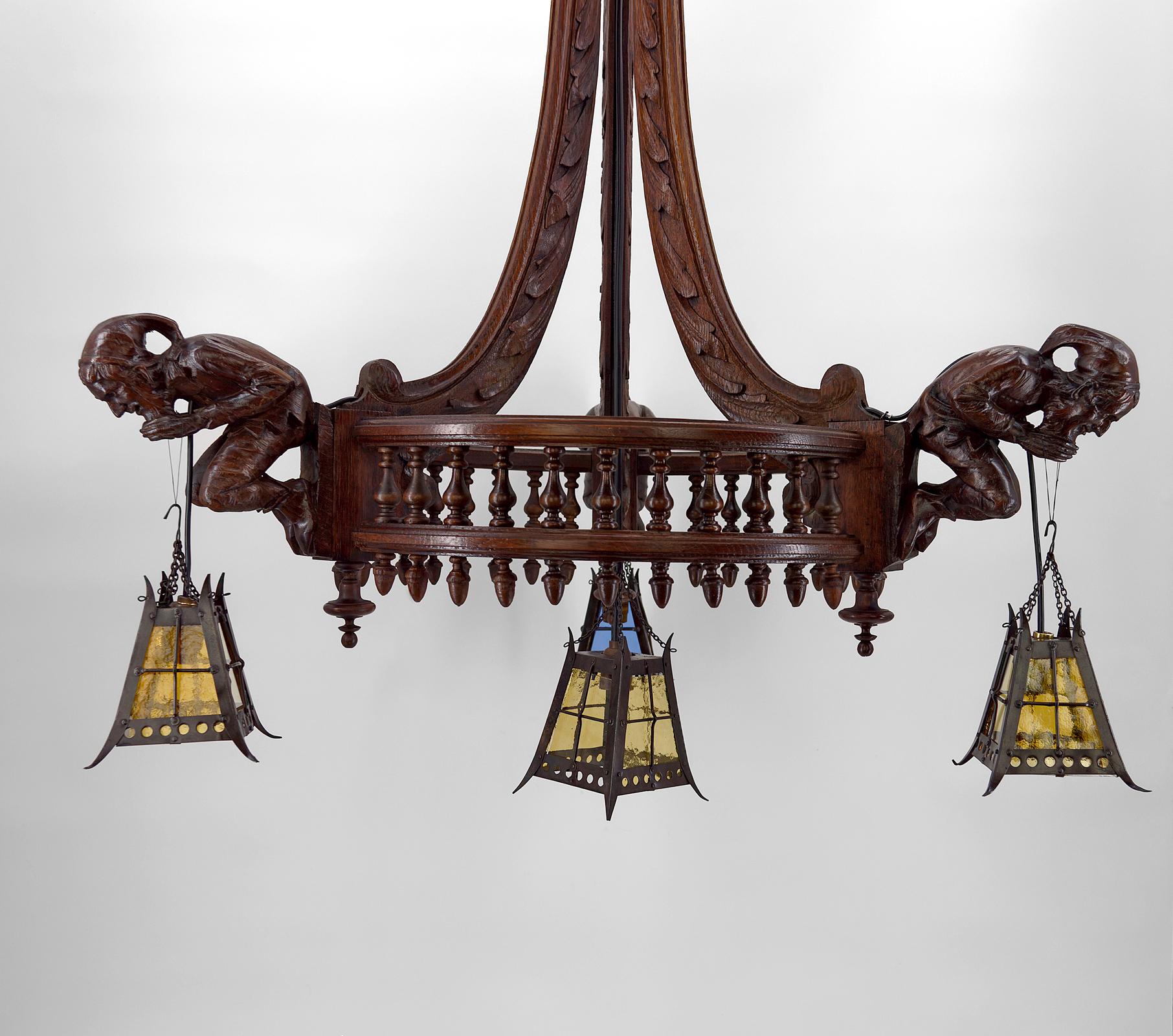 Gothic Chandelier Carved with Jesters and Lanterns, France, circa 1900 In Good Condition For Sale In VÉZELAY, FR
