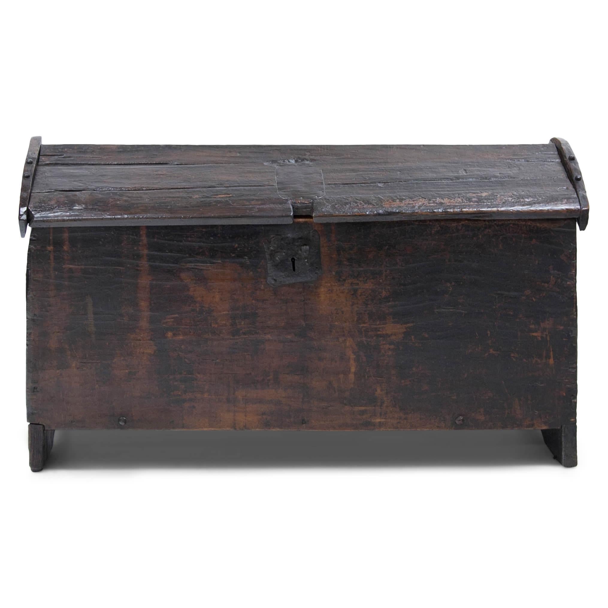 Large Gothic chests in simple built, standing on carved out sides. The lid is rounded and attached with single hinges. Escutcheon in iron, key not available. Divided interior.