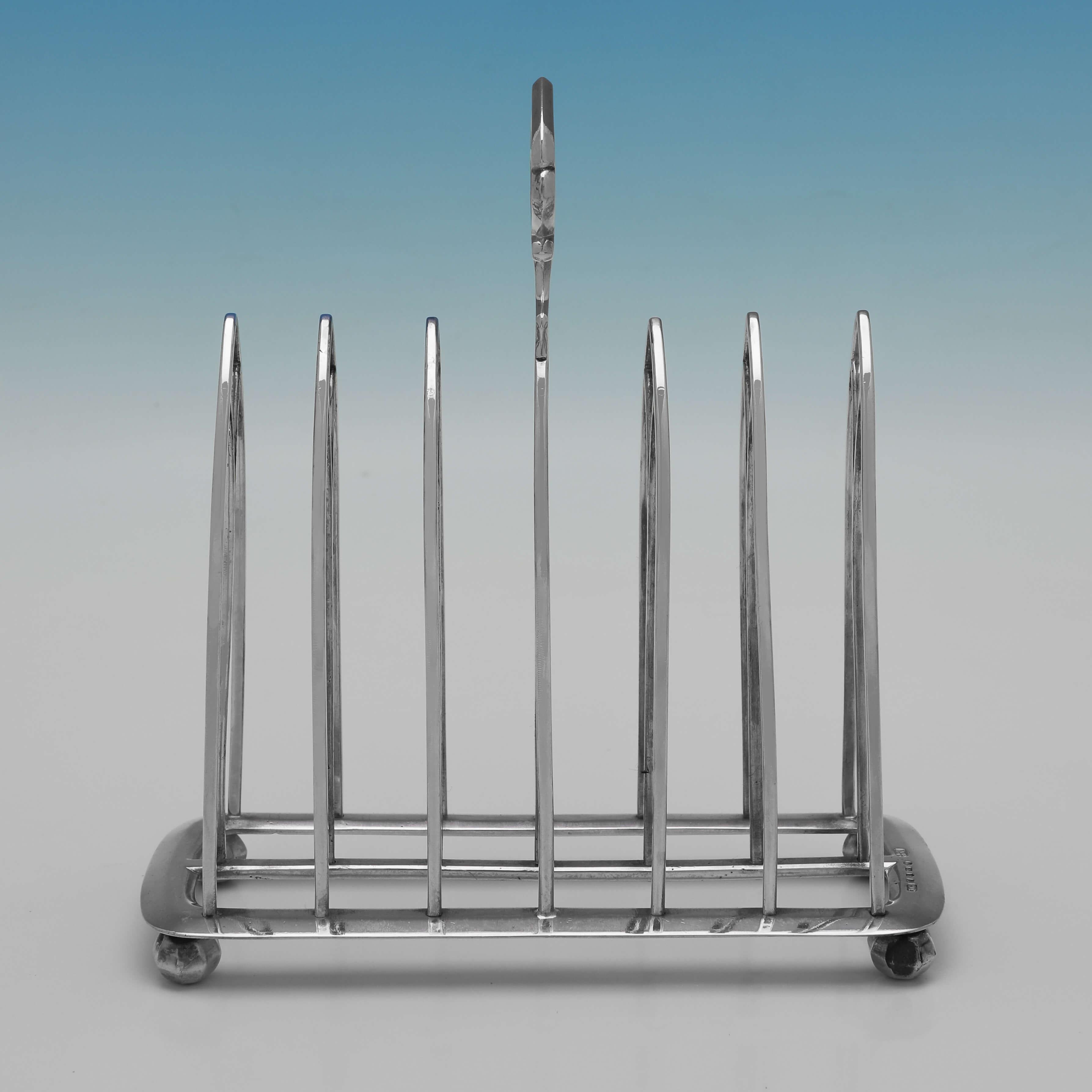 Hallmarked in Birmingham in 1846, possibly by John Gilbert, and also carrying the retail shop mark of James Braham (located at 8 the Strand, Torquay) this very stylish, Victorian, Antique Sterling Silver Toast Rack, is in the Gothic style, and will