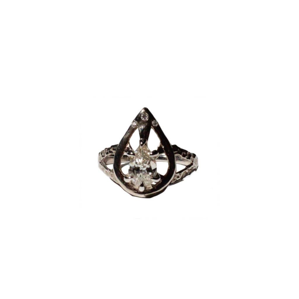 This beautiful champagne diamond ring is inspired by gothic architecture and wrought iron work. 
Solid 14 karat white gold with detailed texture through out. 

Size 7.5
0.71ct 7.67x5.00x2.94mm SI2 Pear Brilliant 