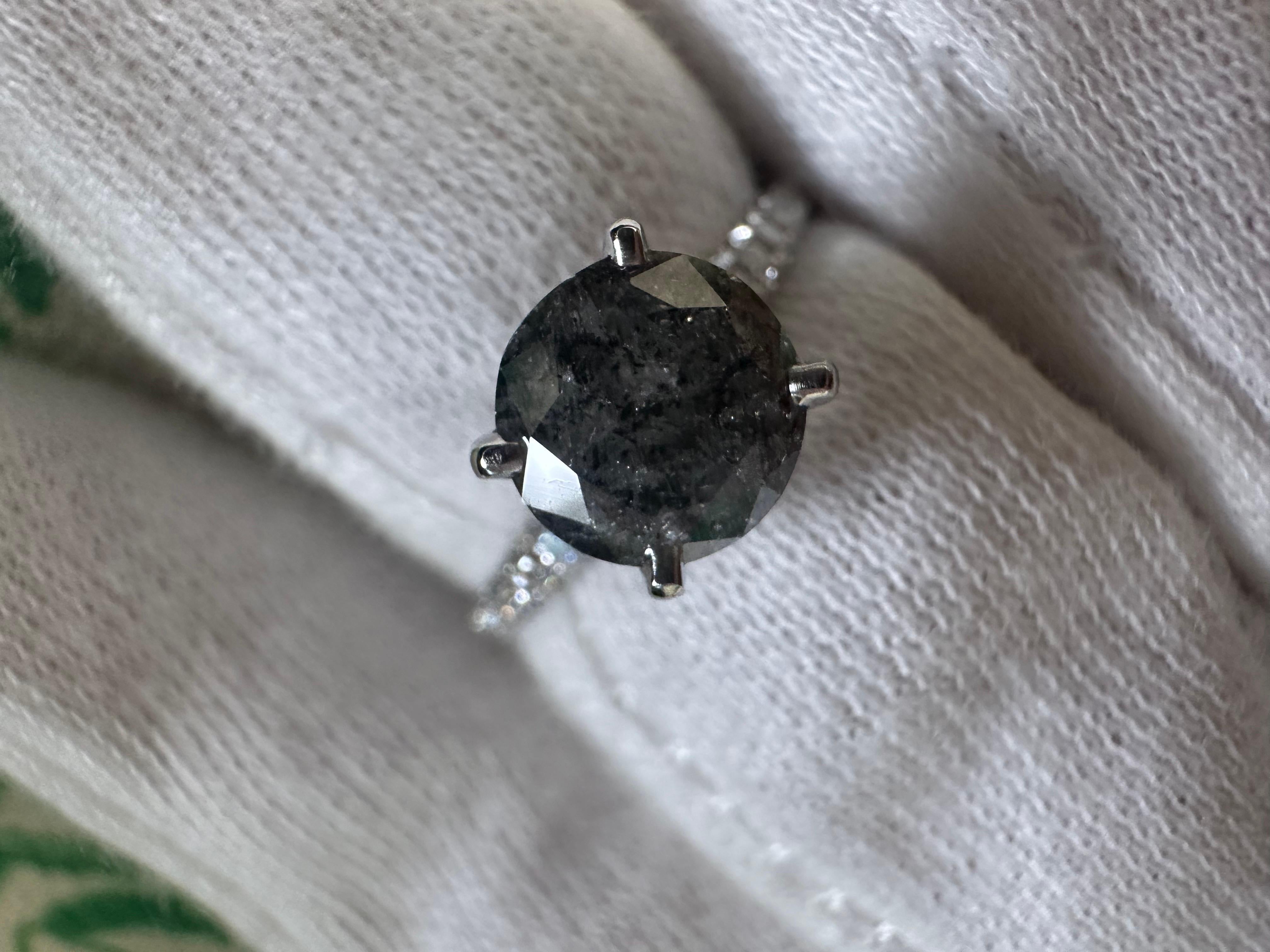 Gothic engagement ring in 18KT white gold, an interesting combination of natural top of the line diamonds at VS clarity and F color and a center a natural black diamond of premium quality. 1ct Black diamond looks smoky and gray and has a lot of